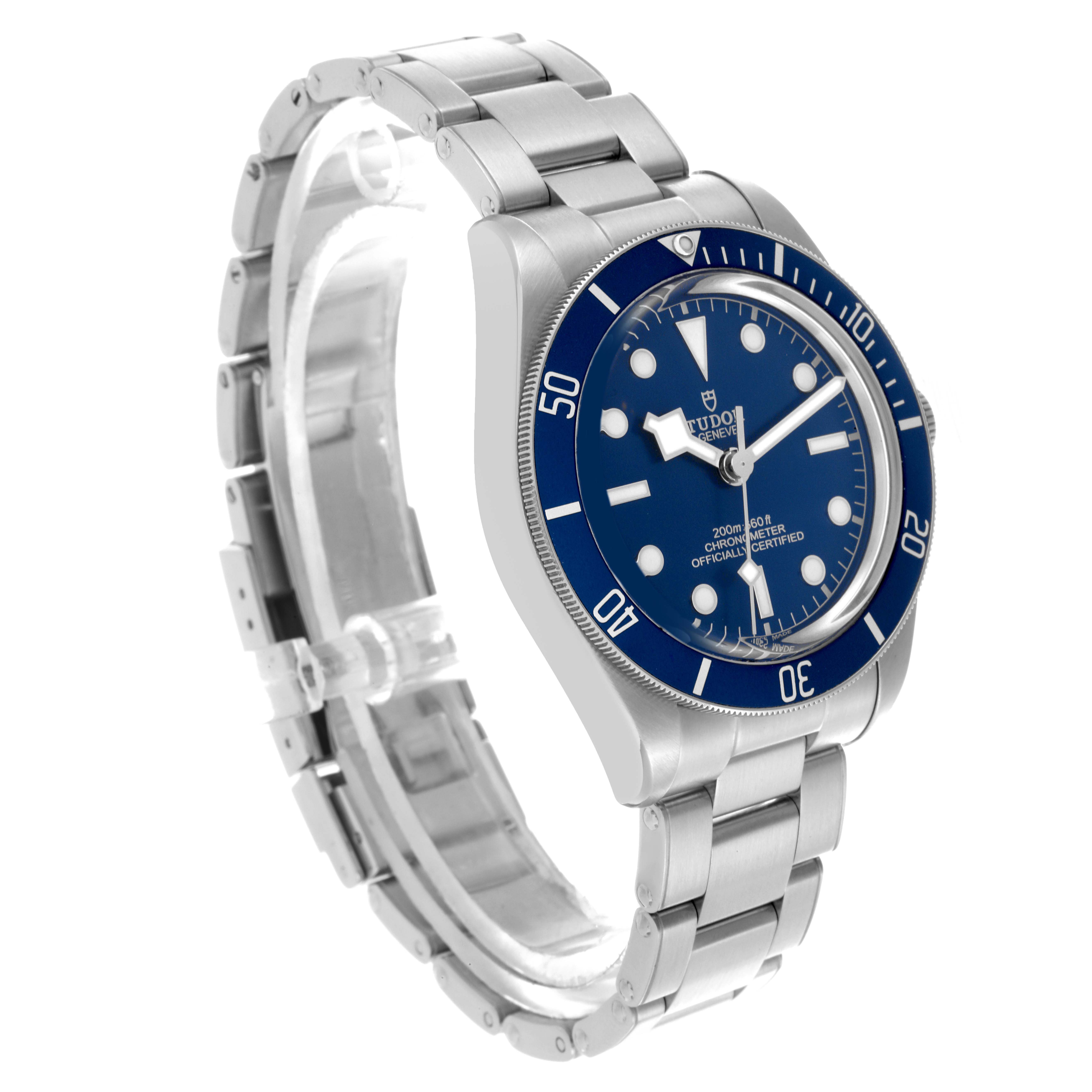The Tudor Heritage Black Bay 79030B Men
s Stainless Steel Blue Dial 79030B Men
s Stainless Steel Blue Dial watch is shown from a side angle, highlighting the blue bezel, dial, and stainless steel bracelet.