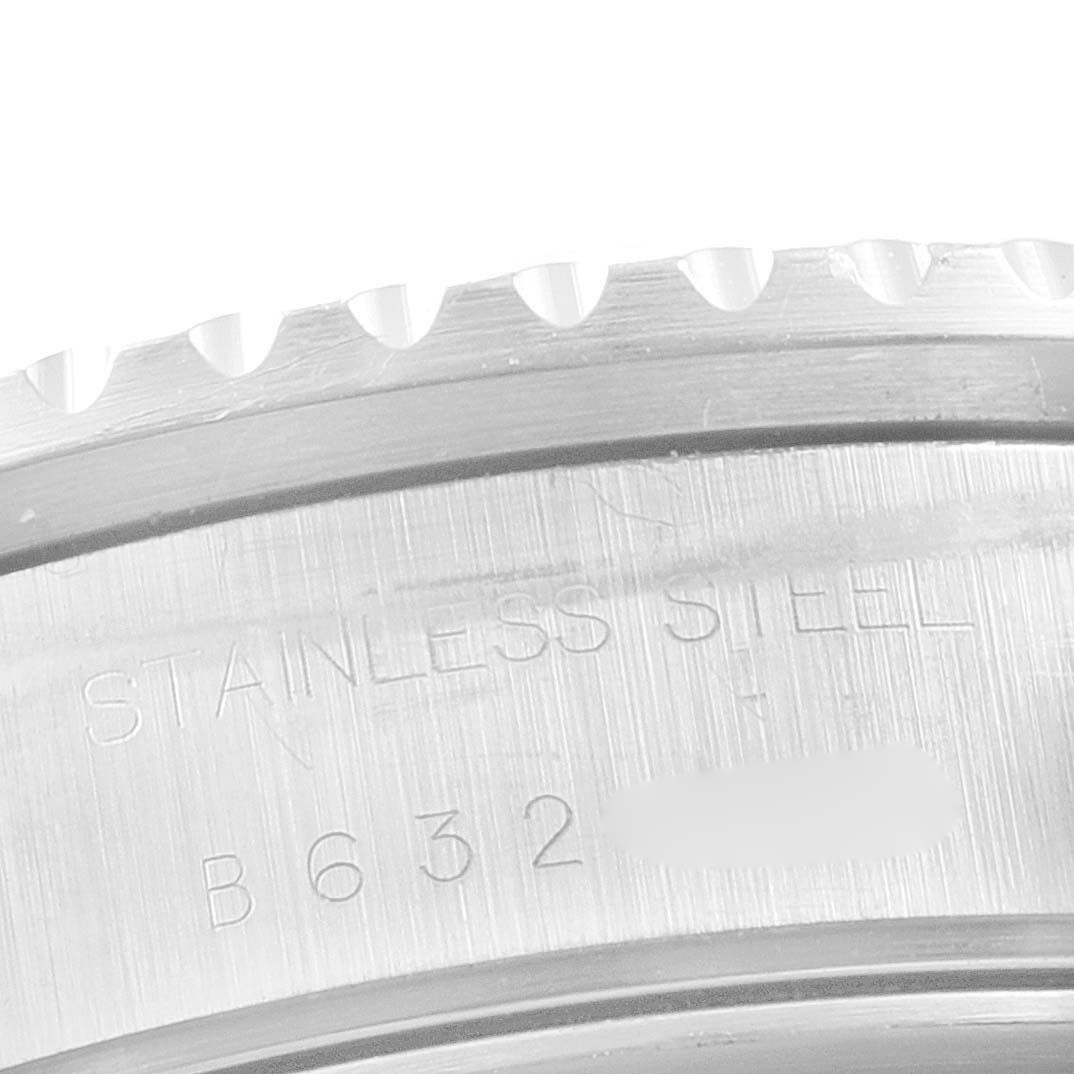 The image shows an angled close-up of the stainless steel bezel of the Tudor Prince 79270 Men's Stainless Steel White Dial 79270 Men's Stainless Steel White Dial model watch with some engraved text visible.