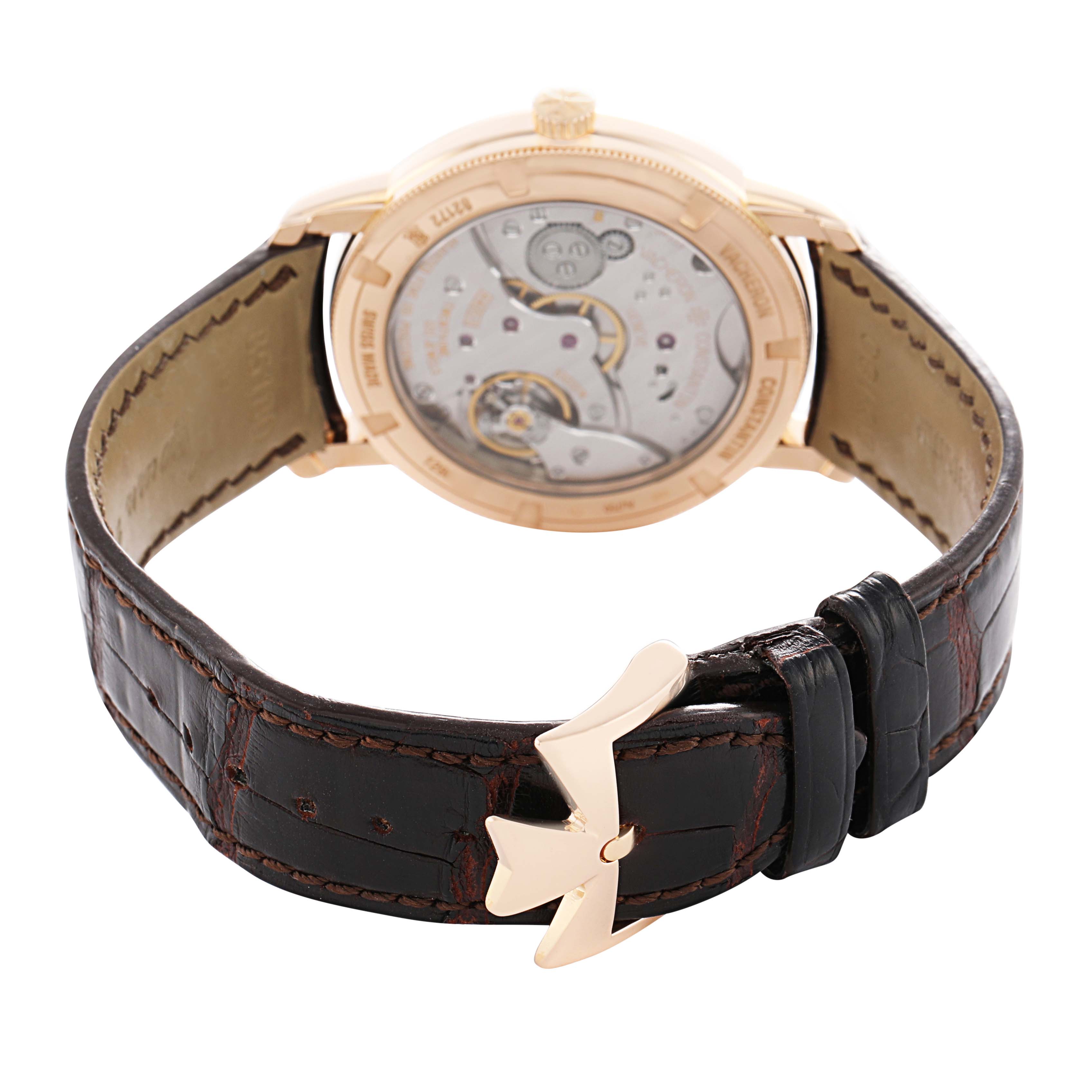 The Vacheron Constantin Traditionnelle 116713 Men's Rose Gold Silver Dial watch is shown from a rear angle, highlighting the movement and leather strap with gold clasp.