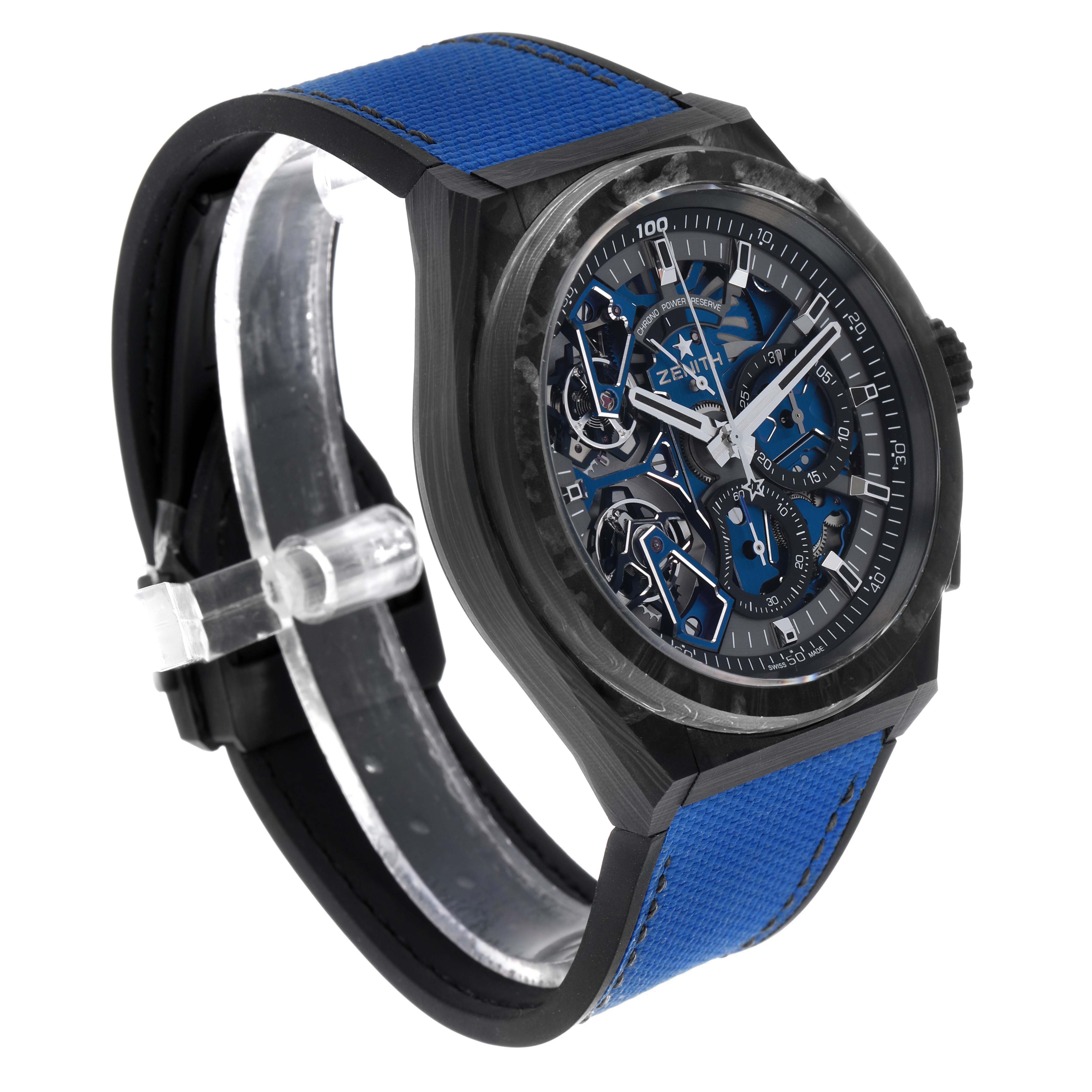 The Zenith Defy 10.9000.9020/79.R918 Men's Titanium Blue Dial watch is shown at an angled side view, highlighting its blue strap and skeleton dial.