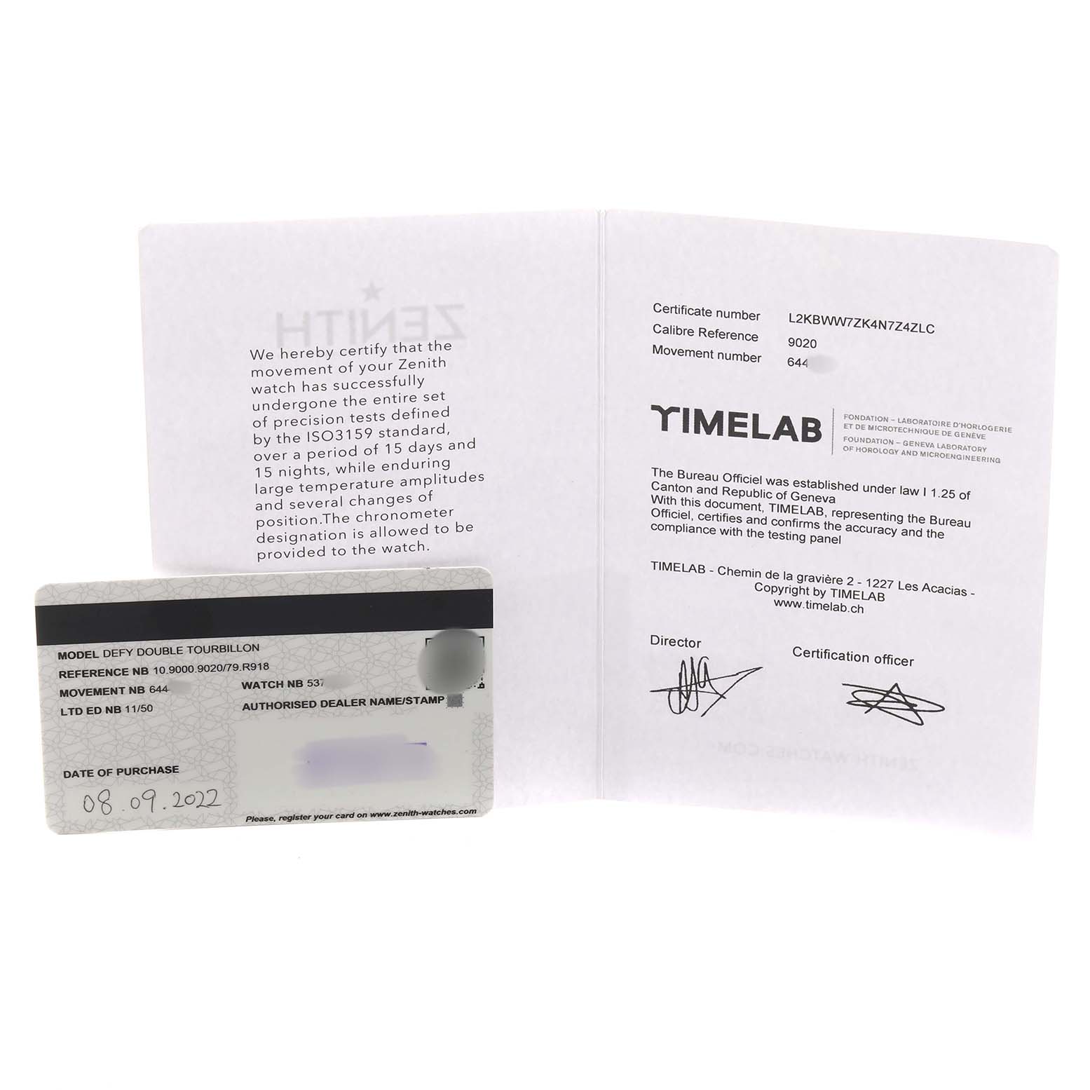 The image shows a Zenith Defy 10.9000.9020/79.R918 Men's Titanium Blue Dial model warranty card and certification documents laid flat.