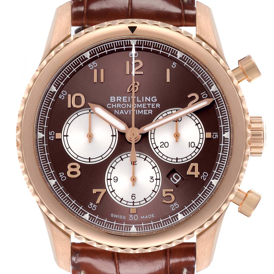 The Breitling Navitimer is shown from the front, displaying the dial, bezel, and leather strap.