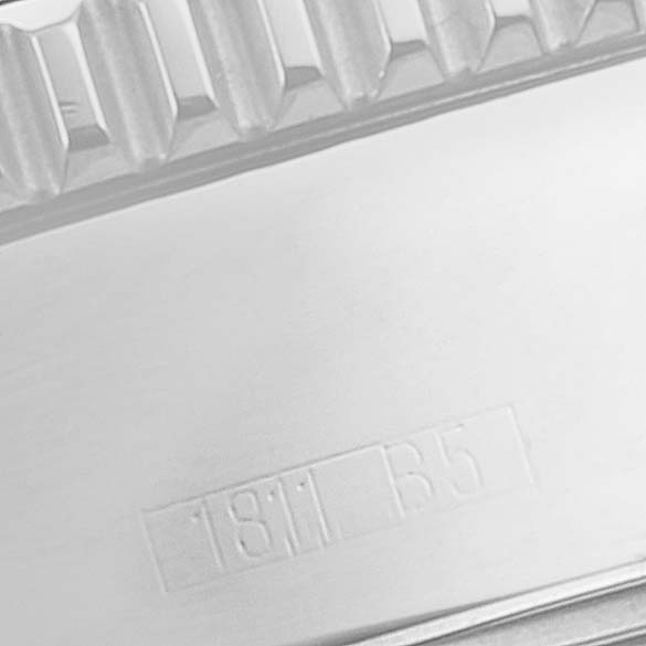 This image shows a close-up of the side of a Breitling Superocean A17364 Men's Stainless Steel Black Dial A17364 Men's Stainless Steel Black Dial watch, focusing on the bezel and some engraved numbers.