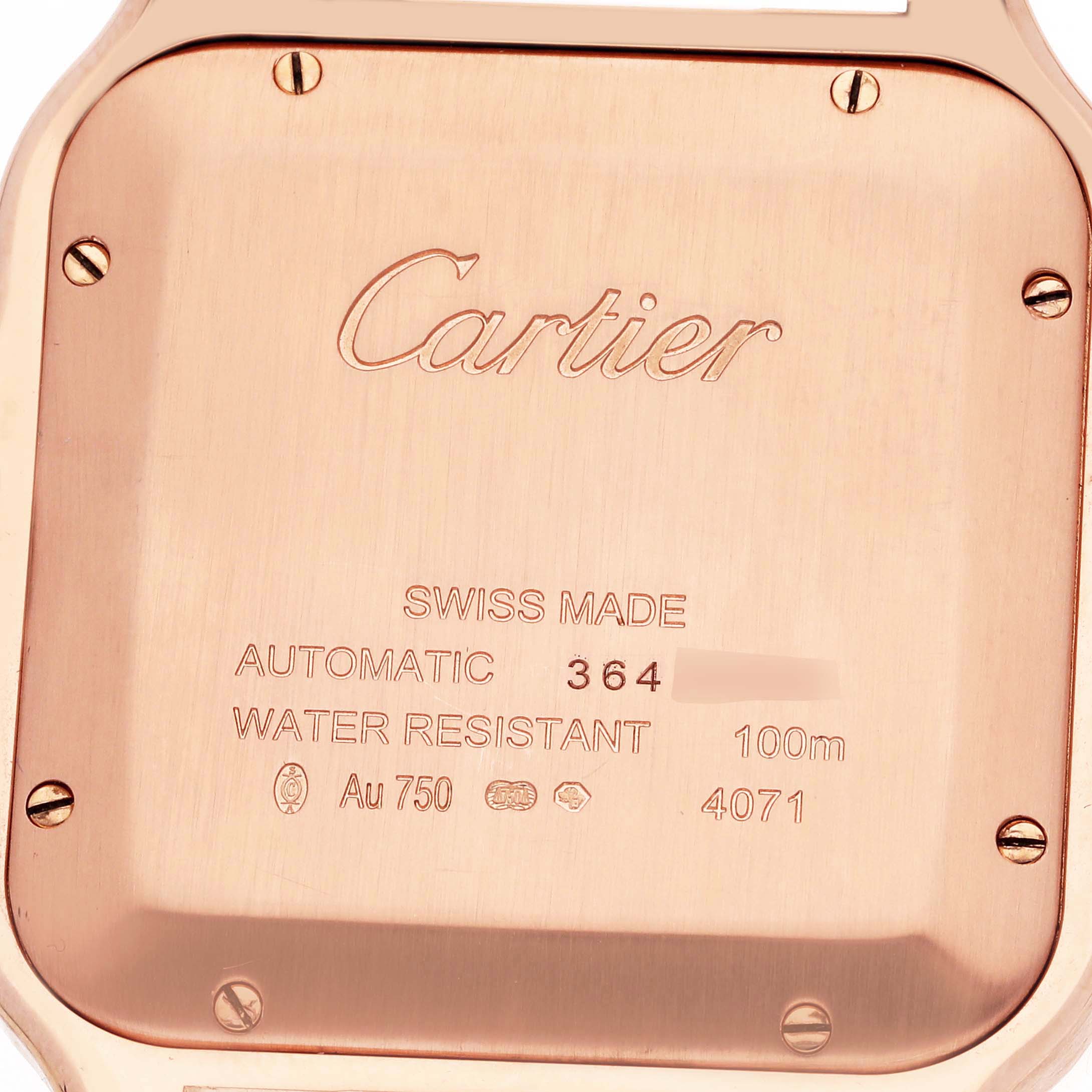 This image shows the back case of a Cartier Santos WGSA0007 Men's Rose Gold Silver Dial WGSA0007 Men's Rose Gold Silver Dial watch, highlighting inscriptions and screws.