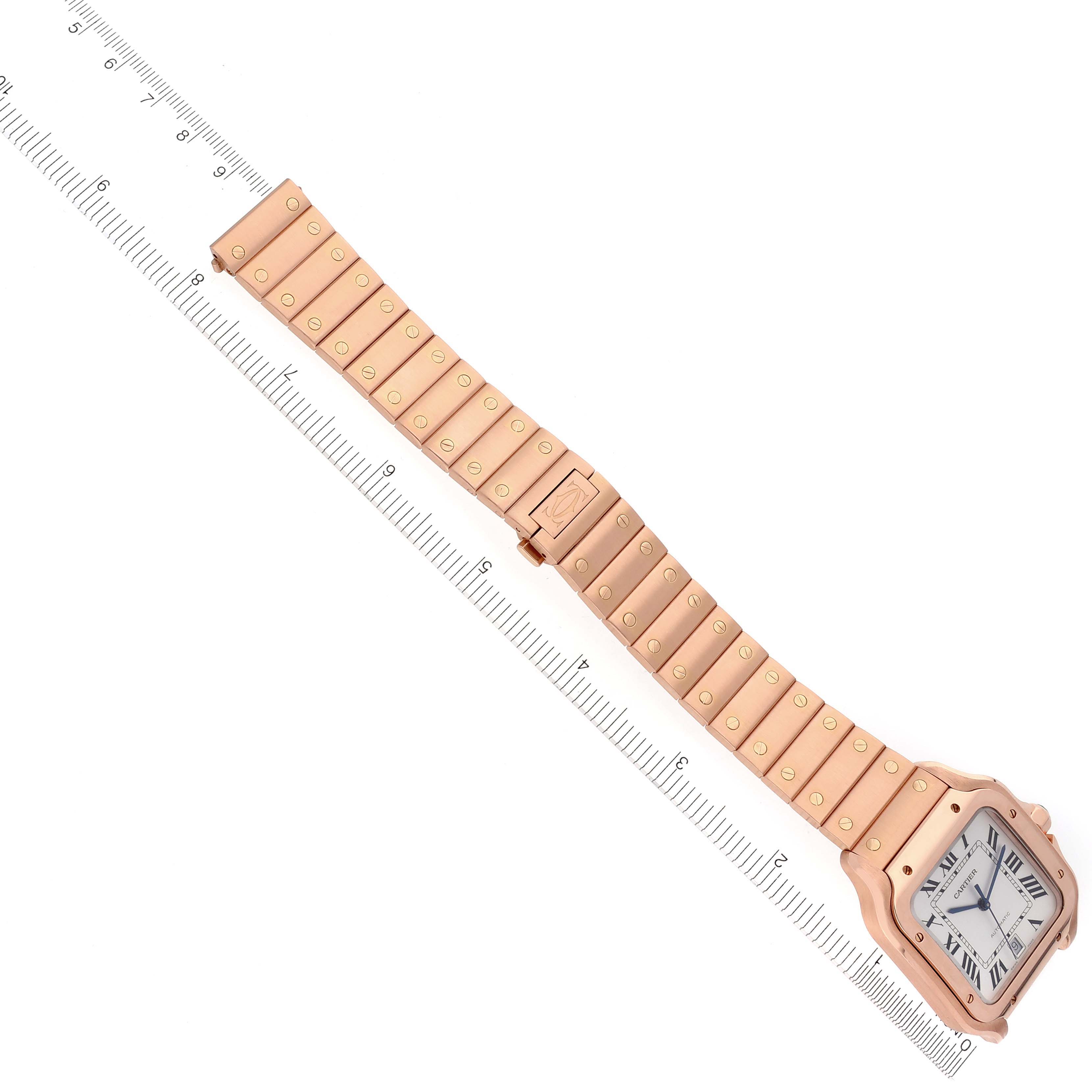 The image shows a Cartier Santos WGSA0007 Men's Rose Gold Silver Dial WGSA0007 Men's Rose Gold Silver Dial watch at a diagonal angle with a ruler, displaying the full bracelet and face.