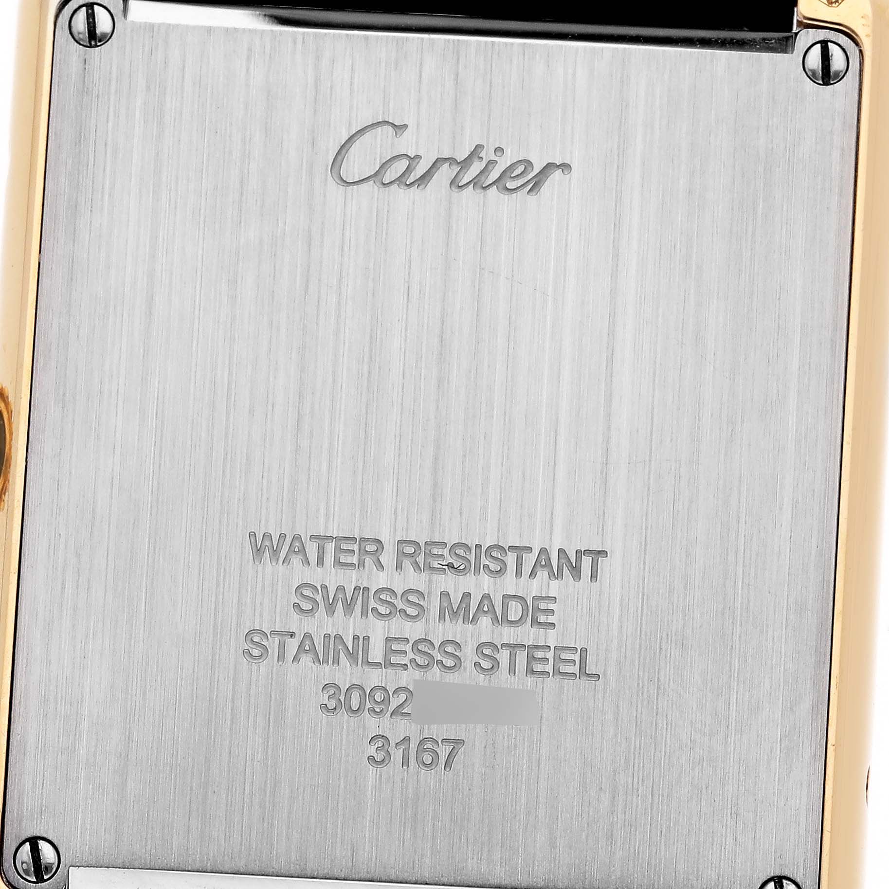 The image shows the back case of a Cartier Tank Solo W5200004 Men's Steel and Gold (two tone) Silver Dial W5200004 Men's Steel and Gold (two tone) Silver Dial watch, highlighting engraving details.