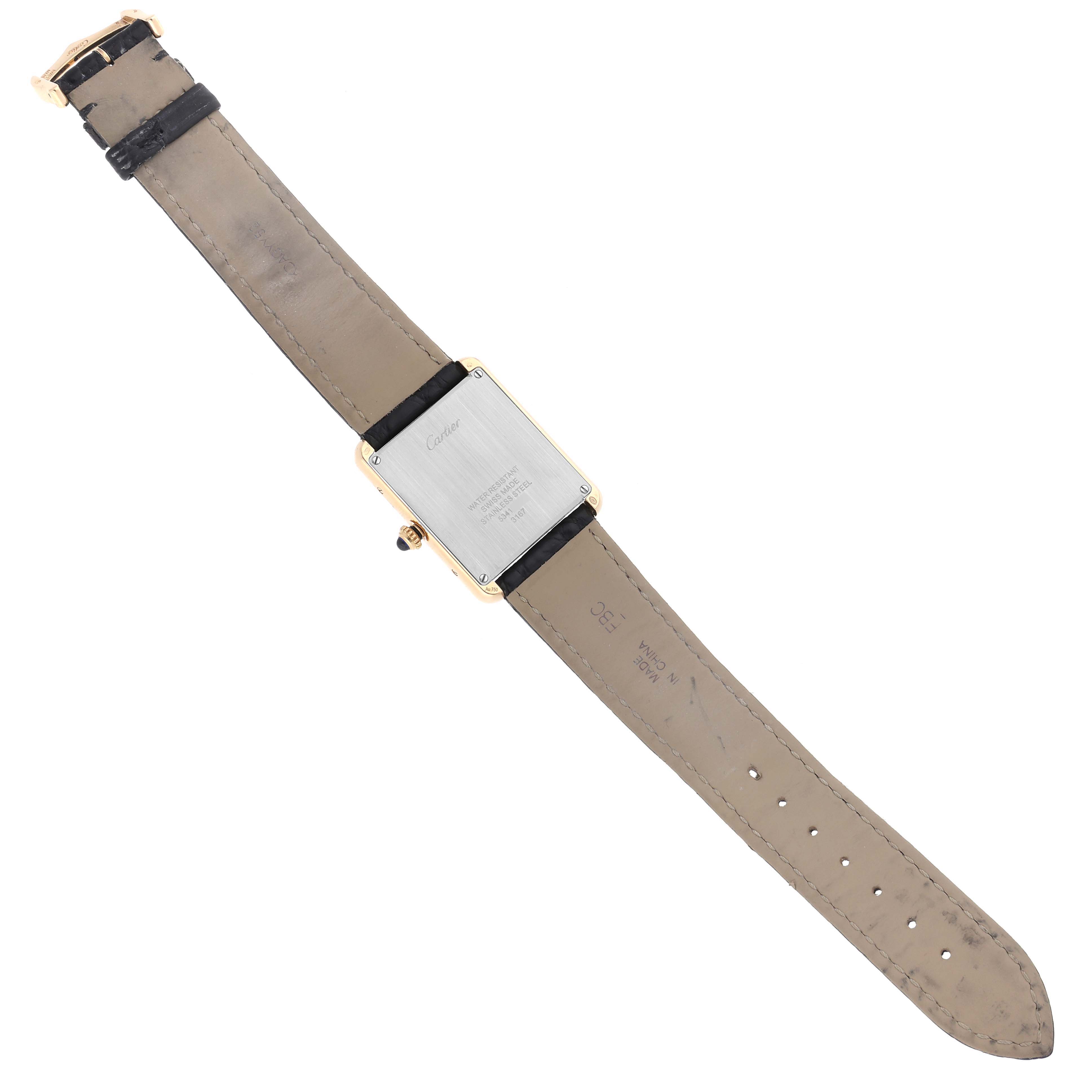 The image shows the back of the Cartier Tank Solo W5200004 Men
s Steel and Gold (two tone) Silver Dial W5200004 Men
s Steel and Gold (two tone) Silver Dial watch with its leather strap fully extended.