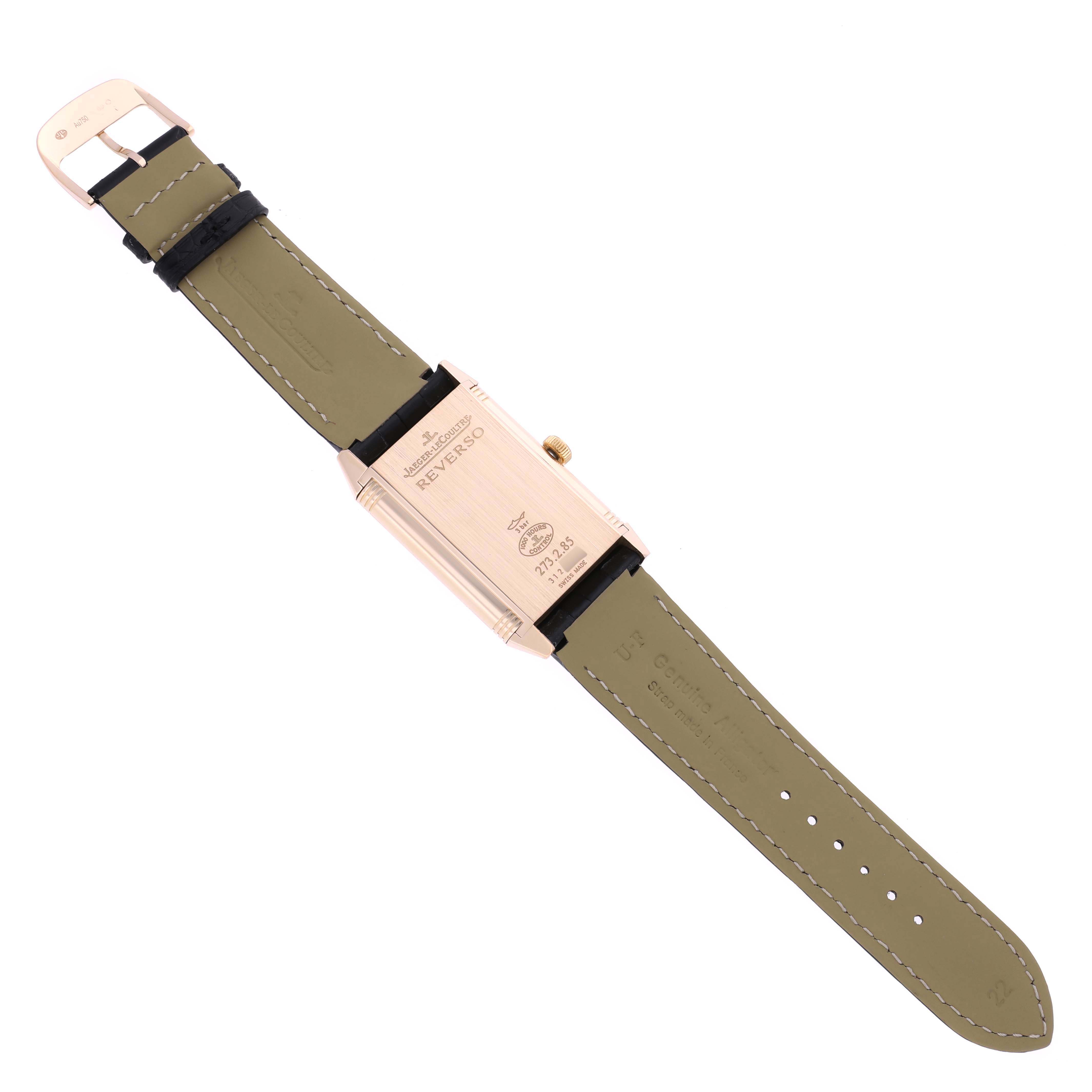 The Jaeger-LeCoultre Reverso watch is shown from the back, displaying the case and olive green leather strap.