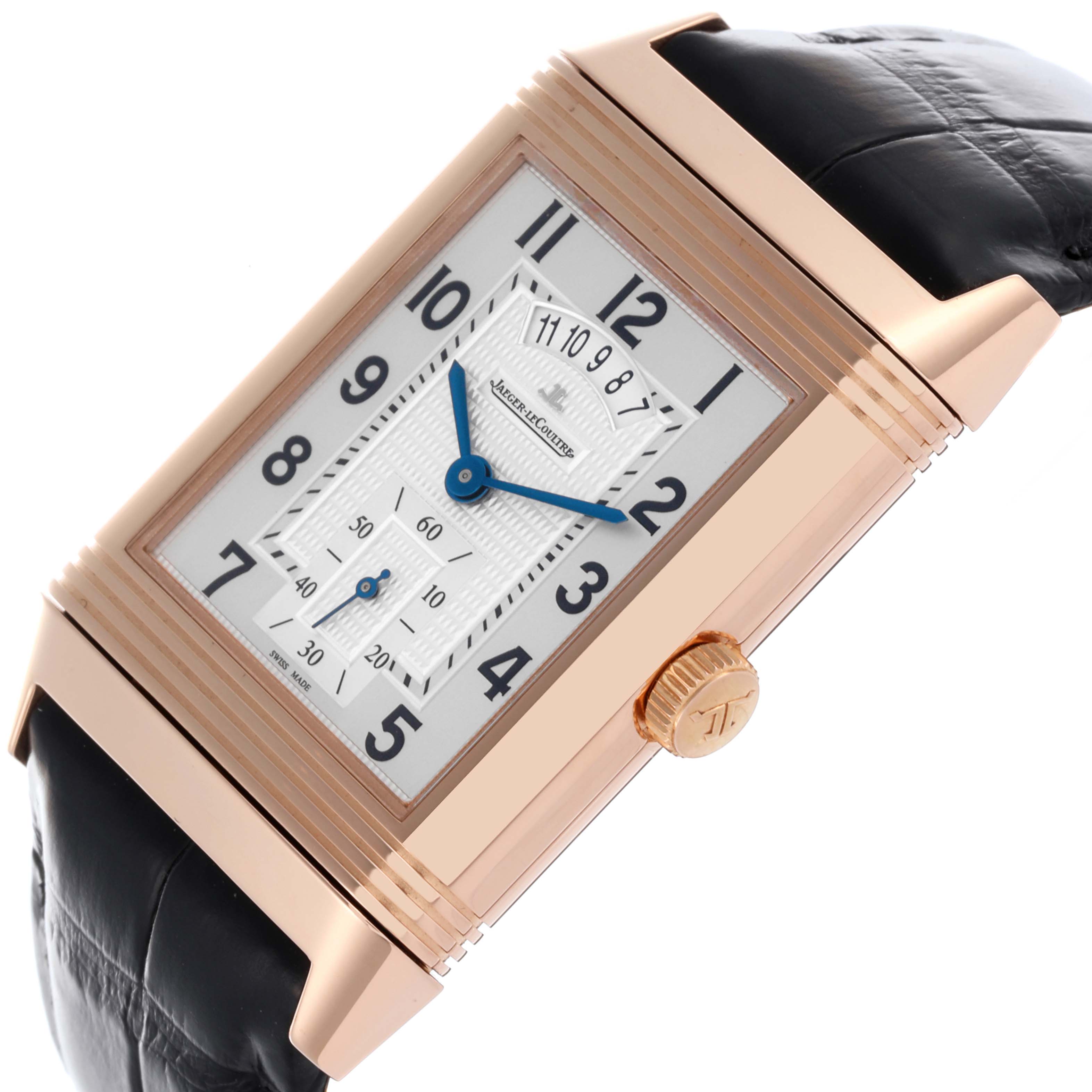 The Jaeger-LeCoultre Reverso watch is shown at a slight angle, displaying its face, crown, and part of the strap.