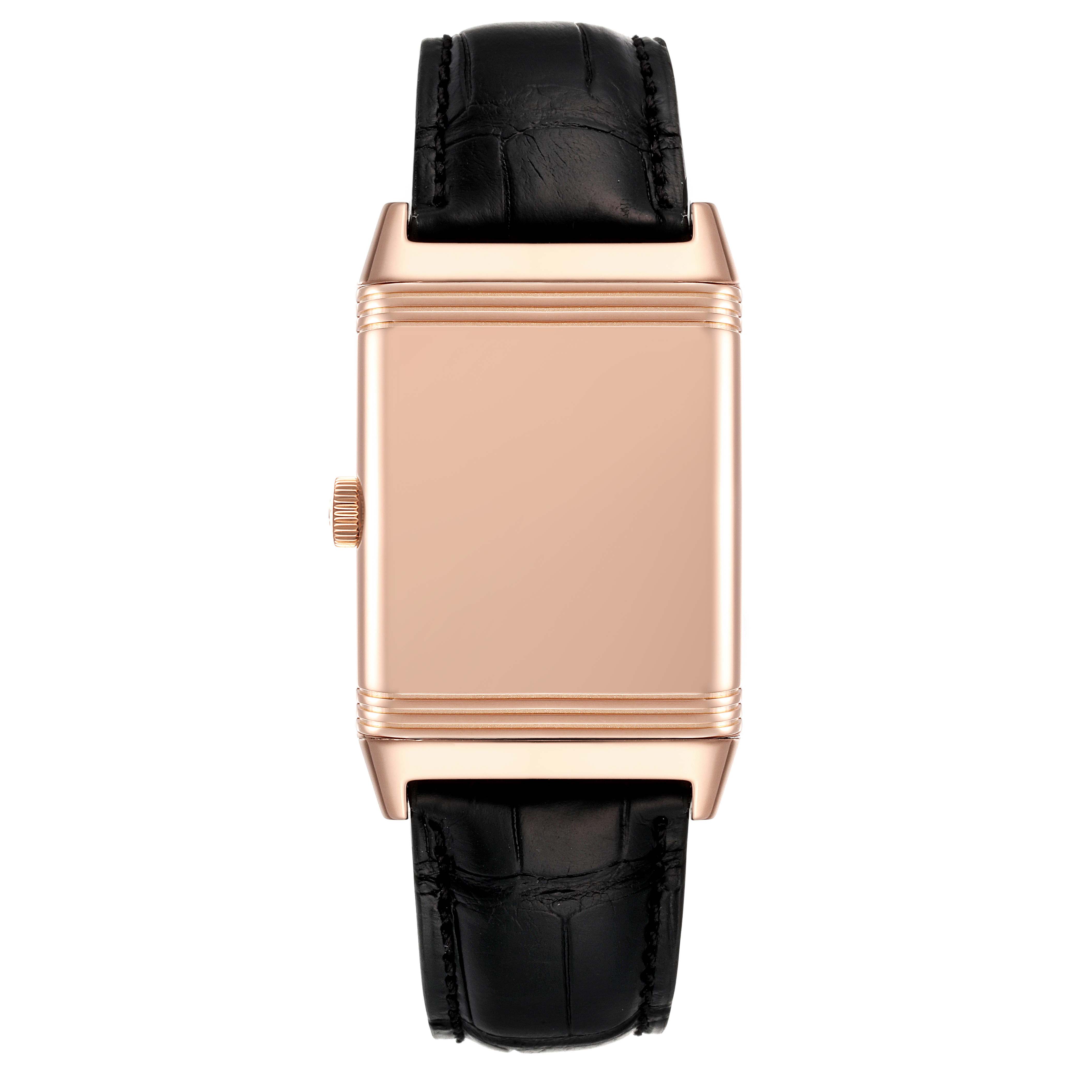 The Jaeger LeCoultre Reverso Q2702420 Men
s Rose Gold Silver Dial Q2702420 Men
s Rose Gold Silver Dial watch is shown from a top-down angle, highlighting the case back and black leather strap.
