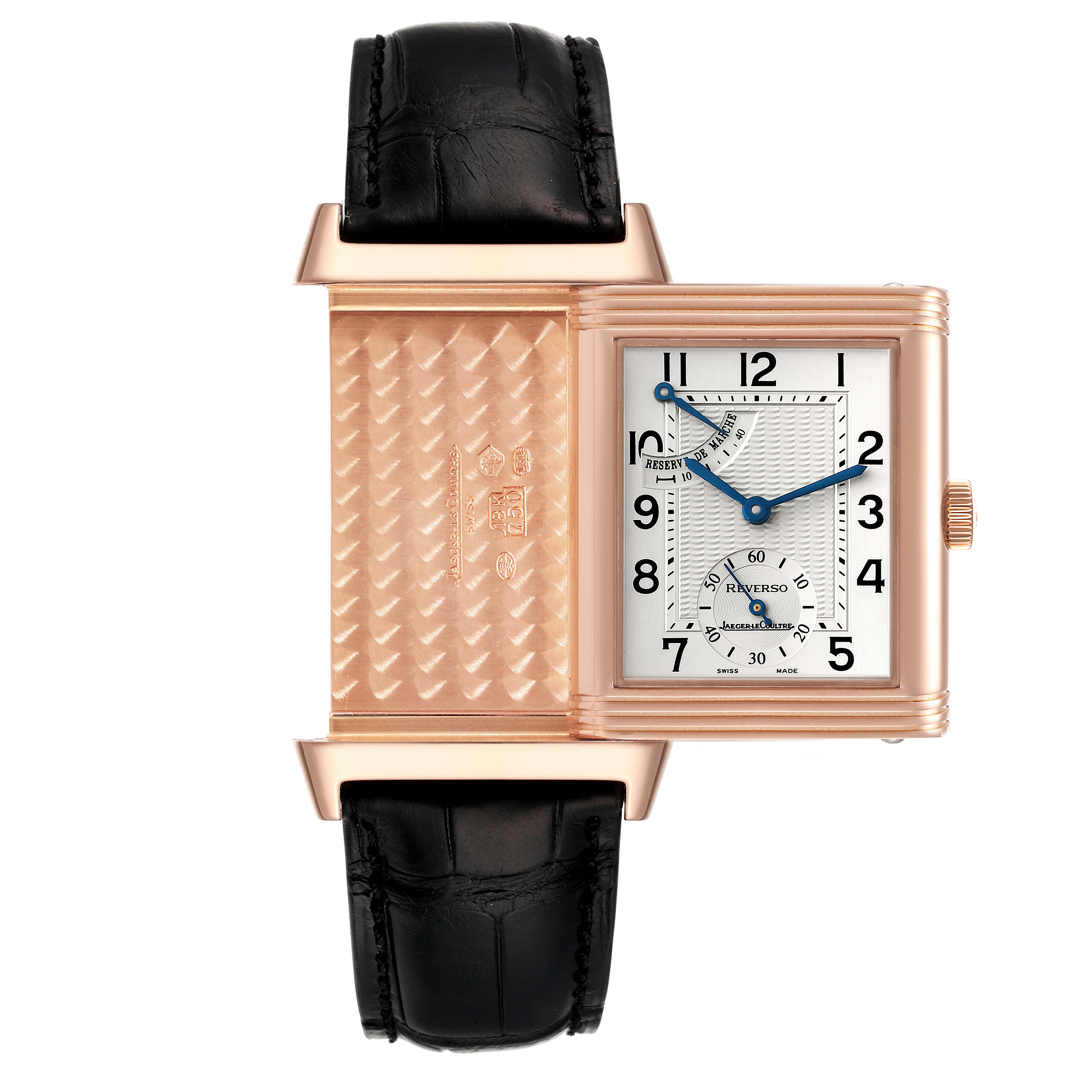 This image shows a Jaeger LeCoultre Reverso Q2702420 Men
s Rose Gold Silver Dial Q2702420 Men
s Rose Gold Silver Dial watch with its case partially flipped, revealing the decorated back and the watch face.
