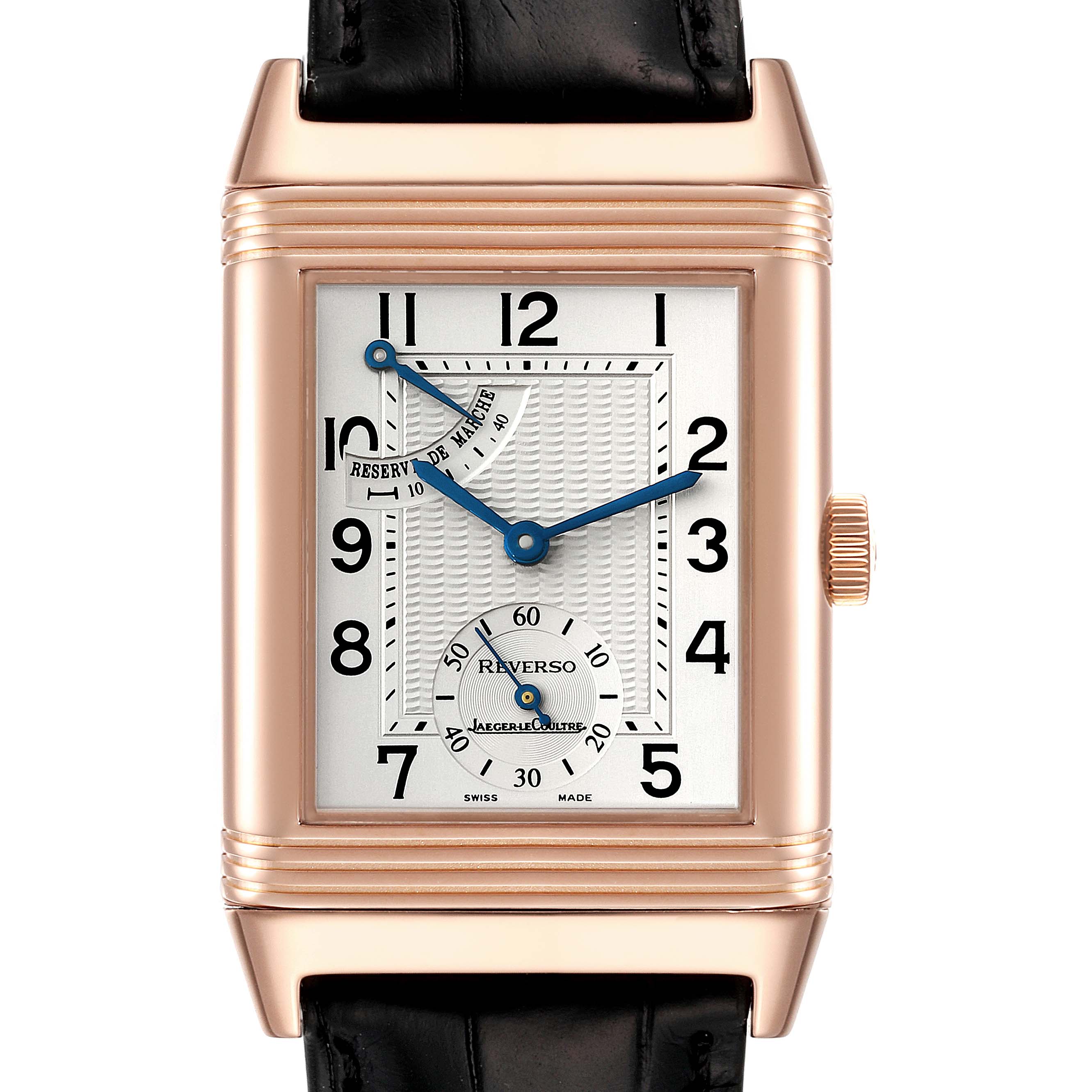 The image shows a front view of the Jaeger-LeCoultre Reverso watch, featuring the dial, hands, and leather strap.