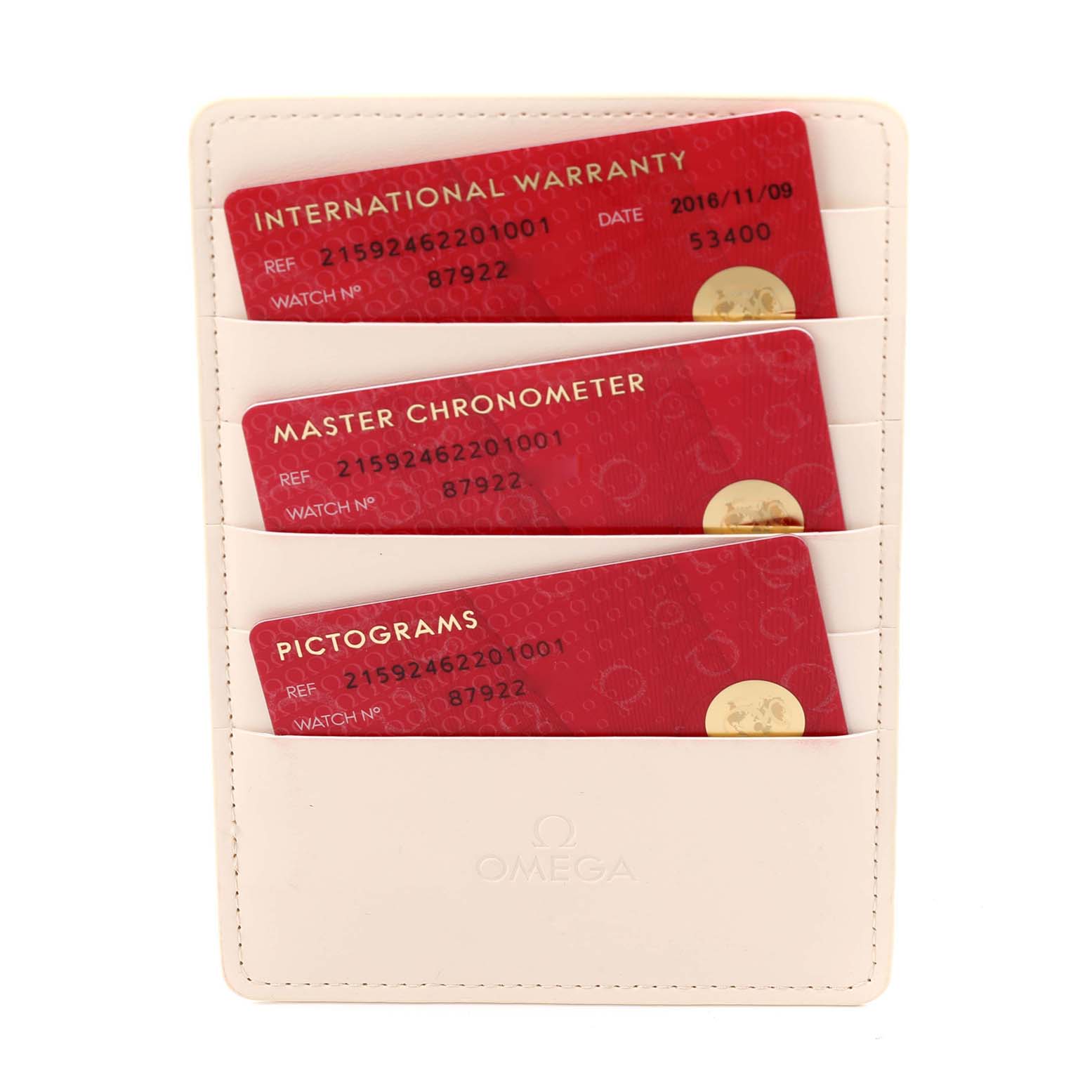 The image shows warranty cards for an Omega Planet Ocean 215.92.46.22.01.001 Men's Ceramic Black Dial 215.92.46.22.01.001 Men's Ceramic Black Dial watch from a top-down angle.