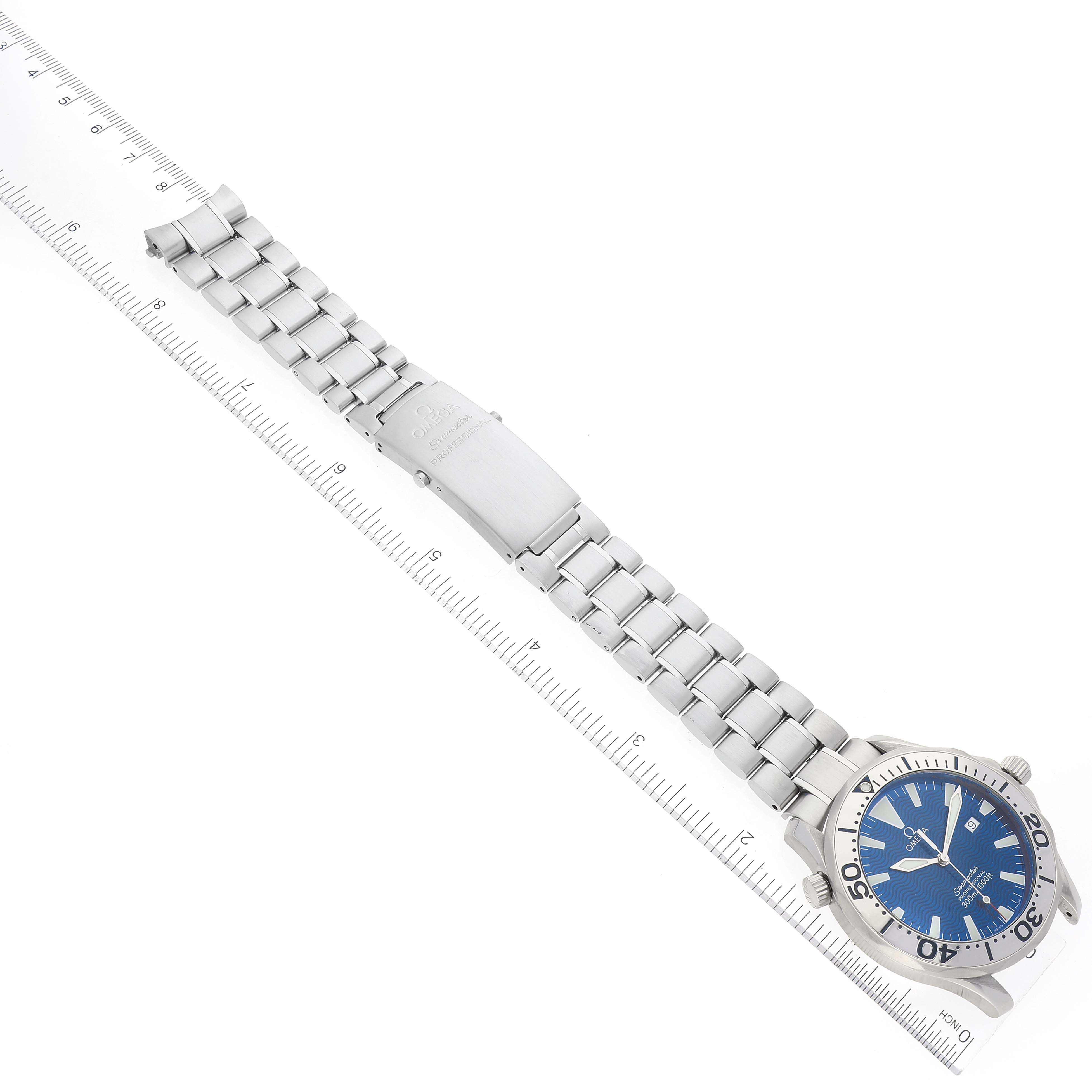 The image shows a top-down angle of an Omega Seamaster 2265.80.00 Men's Stainless Steel Blue Dial 2265.80.00 Men's Stainless Steel Blue Dial watch displaying the full bracelet, clasp, and face with a ruler for scale.
