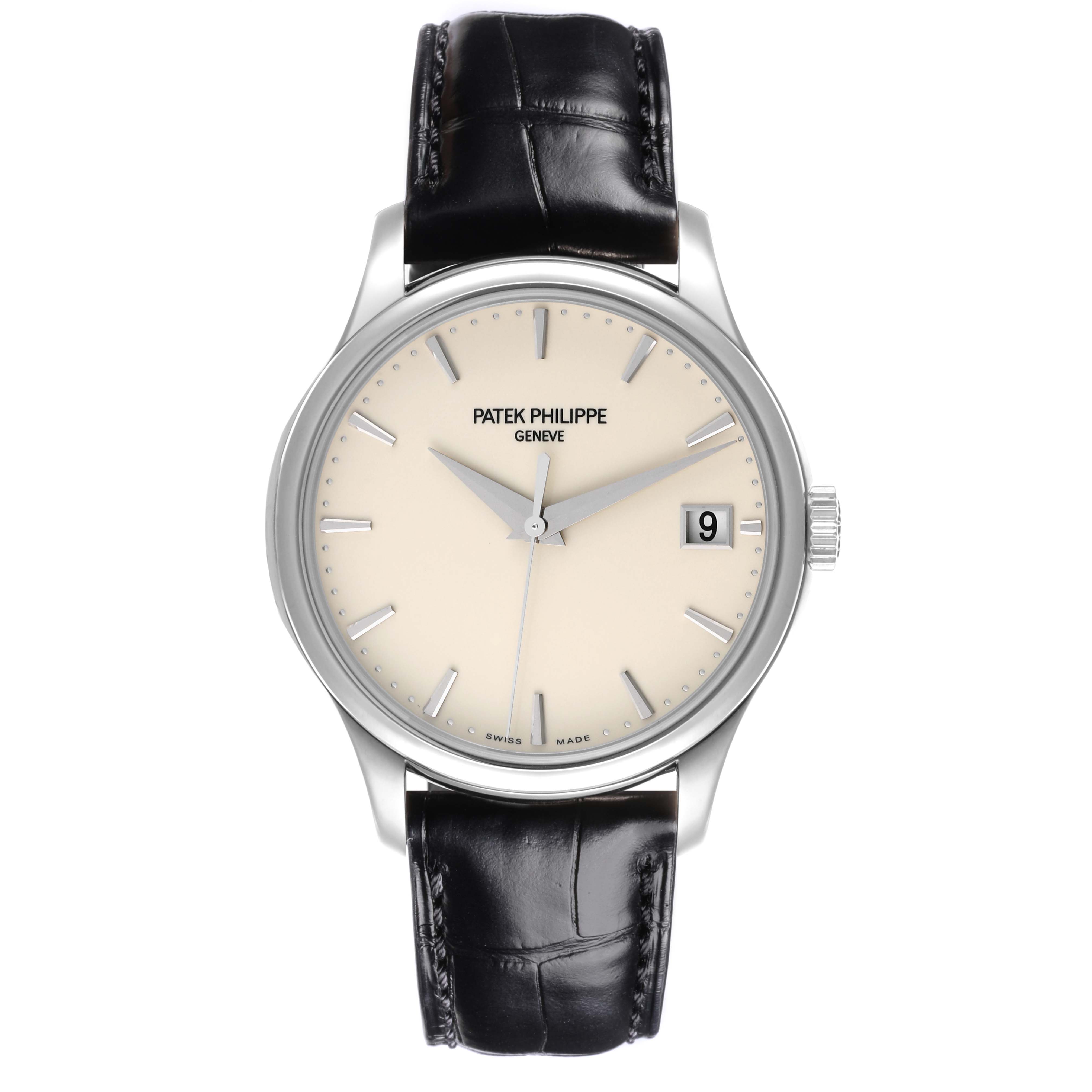 The Patek Philippe Calatrava 5227G-001 Men's White Gold Beige Dial 5227G-001 Men's White Gold Beige Dial watch is shown from a frontal angle, displaying the face, hands, dial, date window, and leather strap.