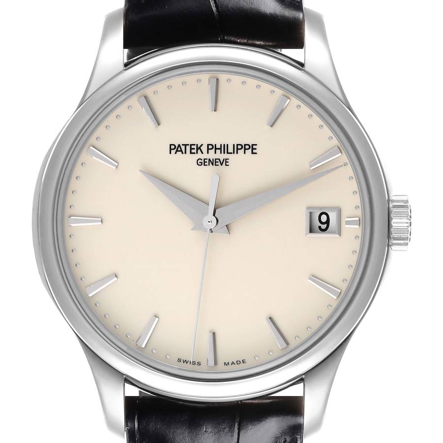 The Patek Philippe Calatrava watch is shown from the front, highlighting the dial, hands, indices, and date window.