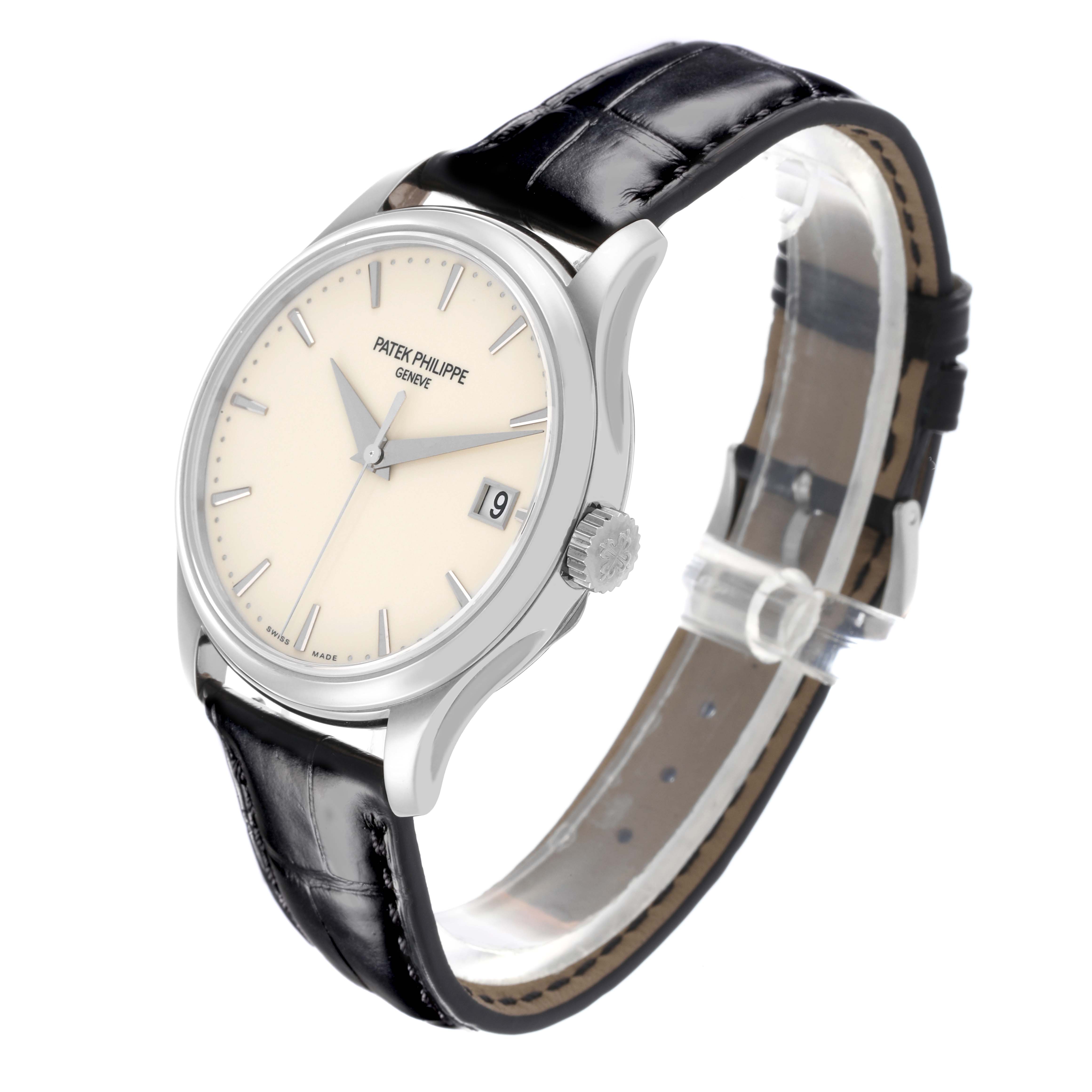 The Patek Philippe Calatrava 5227G-001 Men's White Gold Beige Dial 5227G-001 Men's White Gold Beige Dial watch is shown at a three-quarter angle highlighting the face, bezel, crown, and leather strap.