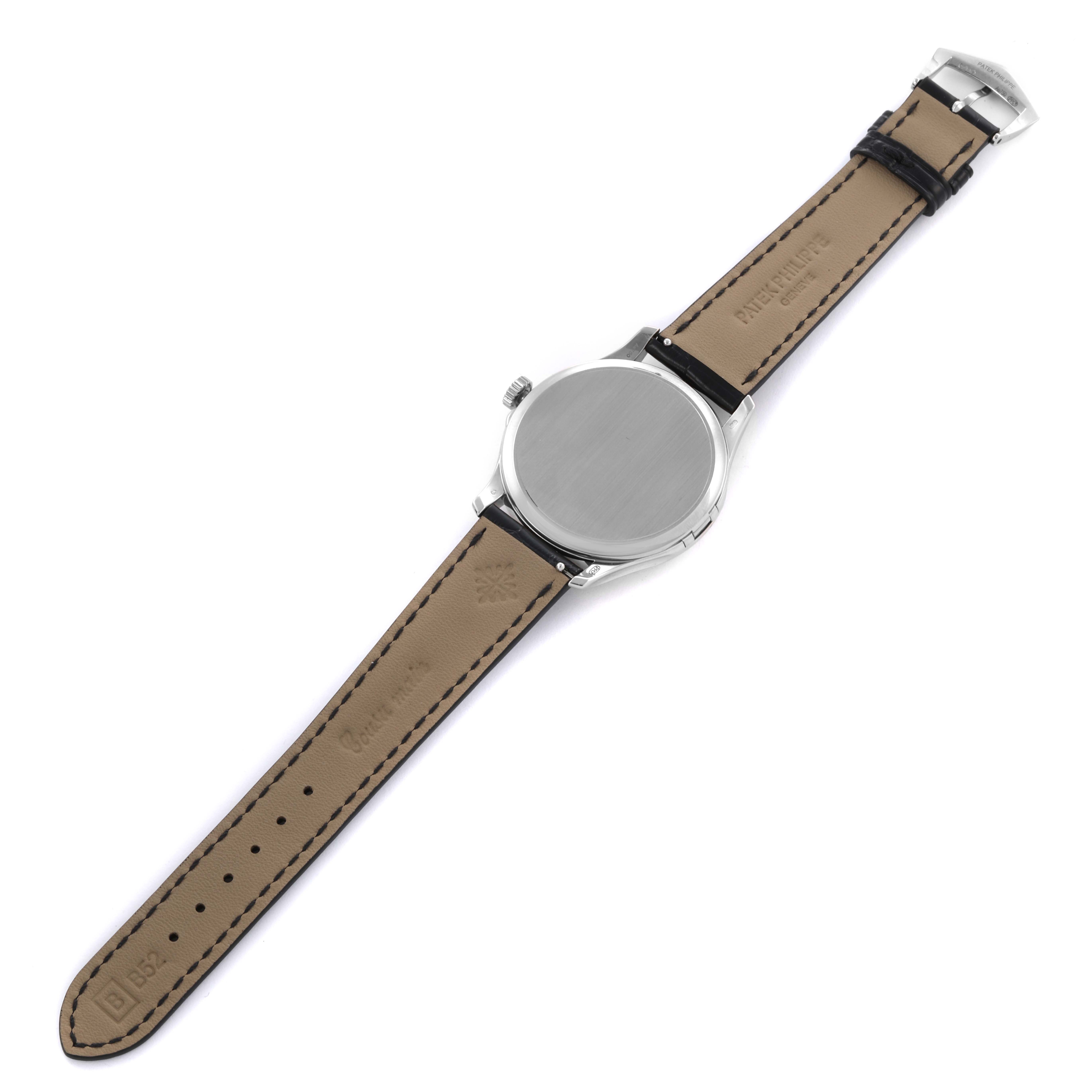 The Patek Philippe Calatrava 5227G-001 Men's White Gold Beige Dial 5227G-001 Men's White Gold Beige Dial watch is shown from the back, displaying its case and leather strap.