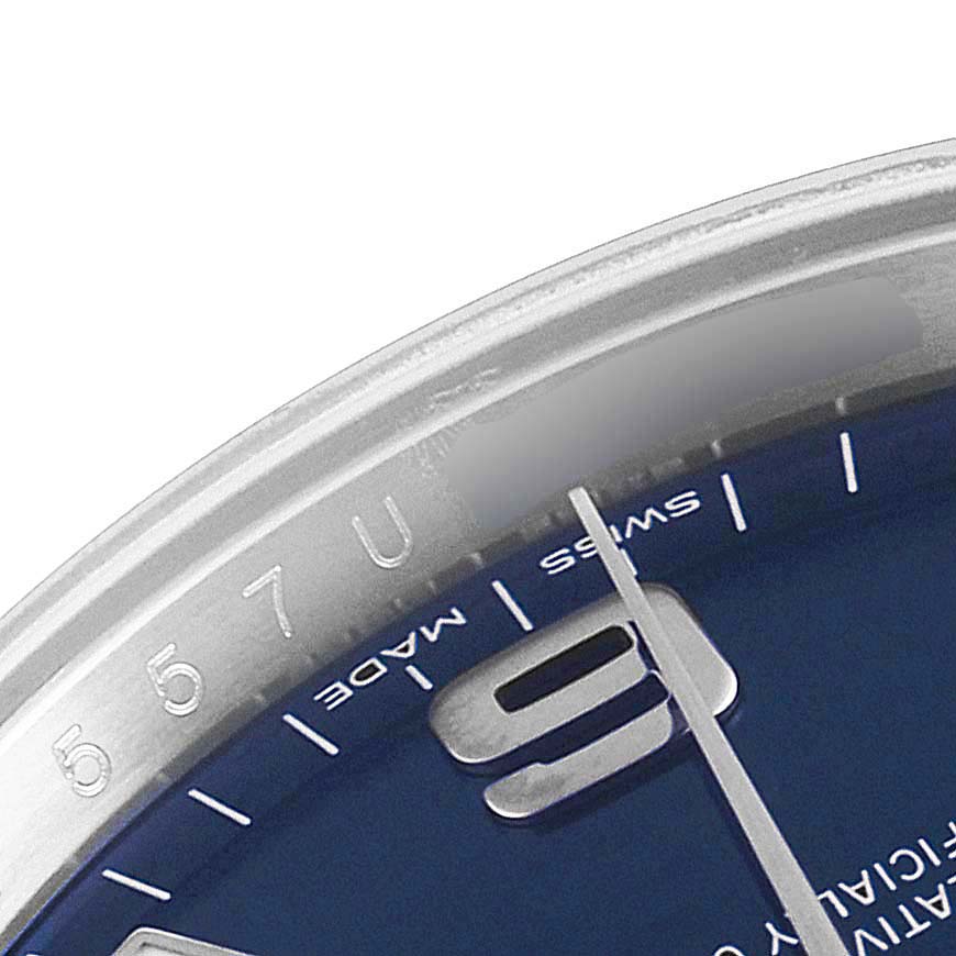 The image shows a close-up of the bezel, part of the dial, and a hand of the Rolex Air-King 114200 Men's Stainless Steel Blue Dial 114200 Men's Stainless Steel Blue Dial watch.