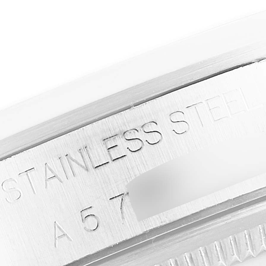 This close-up image shows the engraved text on the stainless steel case of a Rolex Air-King 14000 Men's Stainless Steel Pink Dial 14000 Men's Stainless Steel Pink Dial watch.