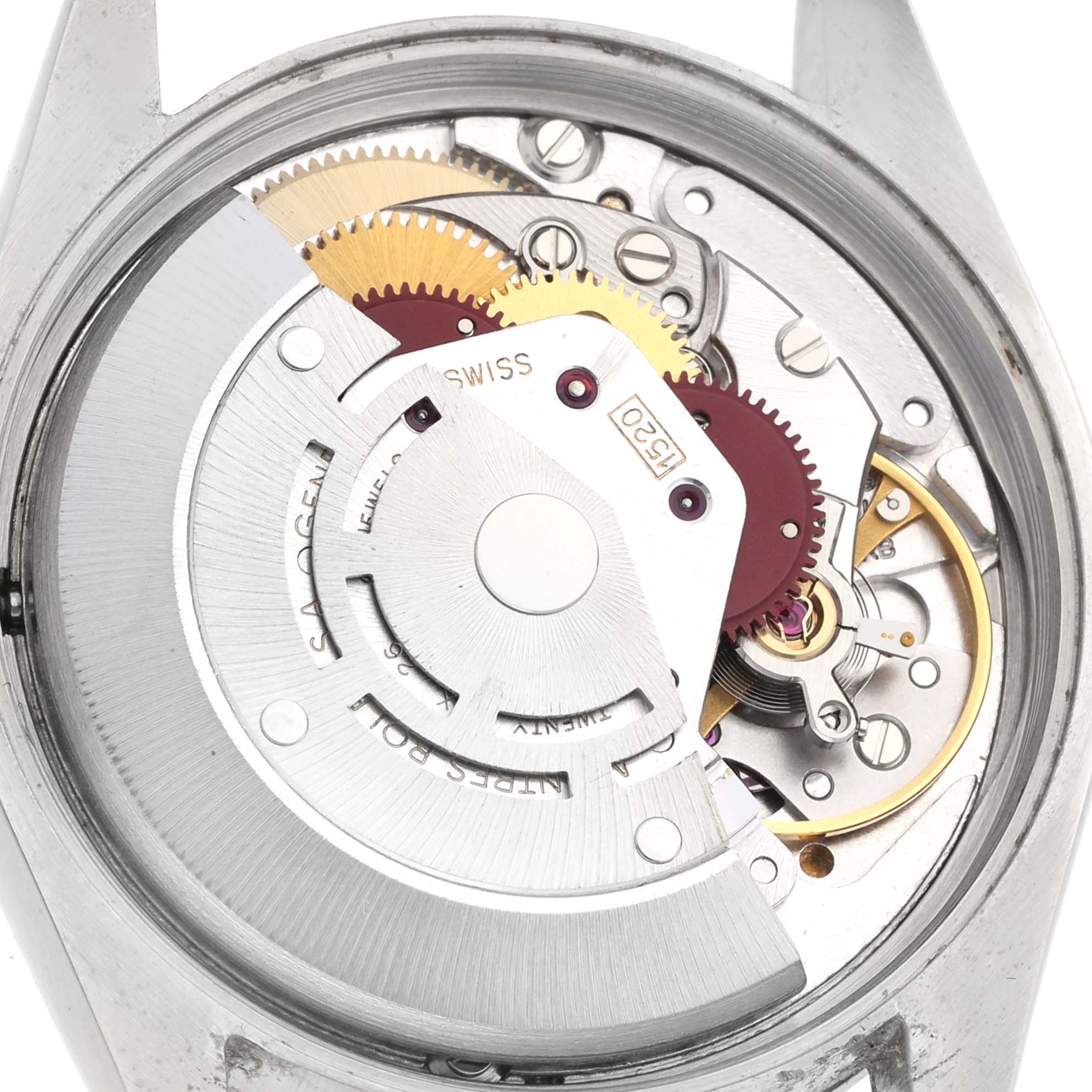 The image shows the internal mechanism of a Rolex Air-King 5500 Men's Stainless Steel Silver Dial 5500 Men's Stainless Steel Silver Dial watch from a rear angle, highlighting its gears and movement parts.
