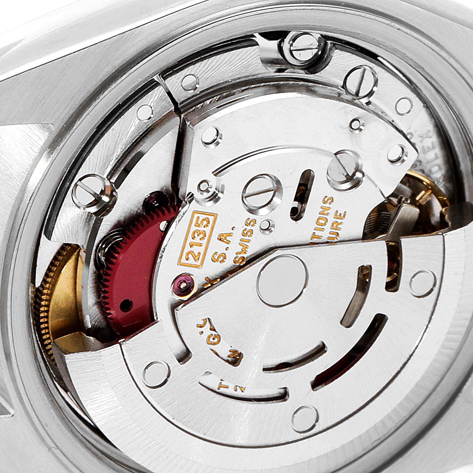 This is a close-up image of the movement of a Rolex Datejust 69173 Women
s Steel and Gold (two tone) Champagne Dial 69173 Women
s Steel and Gold (two tone) Champagne Dial watch, showing intricate internal components.