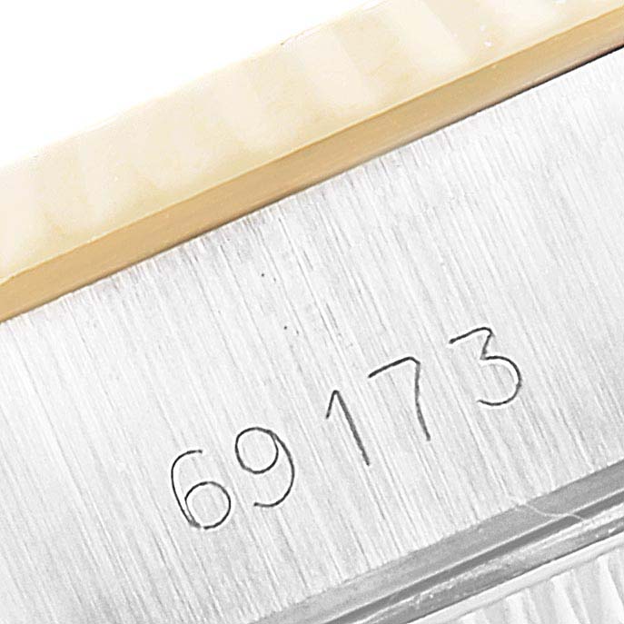 This image shows the case model number of the Rolex Datejust 69173 Women
s Steel and Gold (two tone) Champagne Dial 69173 Women
s Steel and Gold (two tone) Champagne Dial, focusing on the side of the watch case.