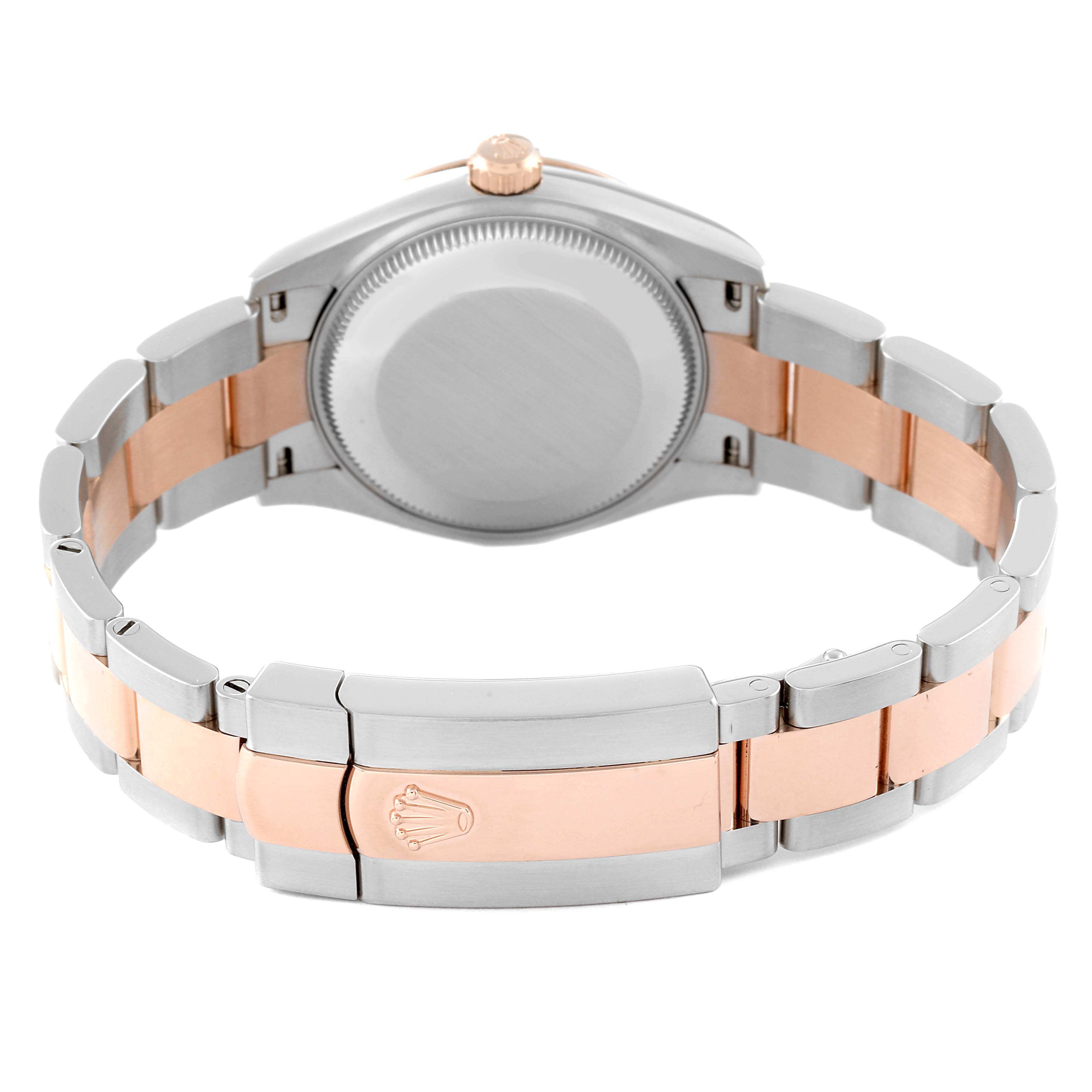 The image shows the back view of a Rolex Mid-Size 278241 Women's Steel and Gold (two tone) Pink Dial 278241 Women's Steel and Gold (two tone) Pink Dial watch, highlighting its two-tone metal bracelet and clasp with the Rolex logo.