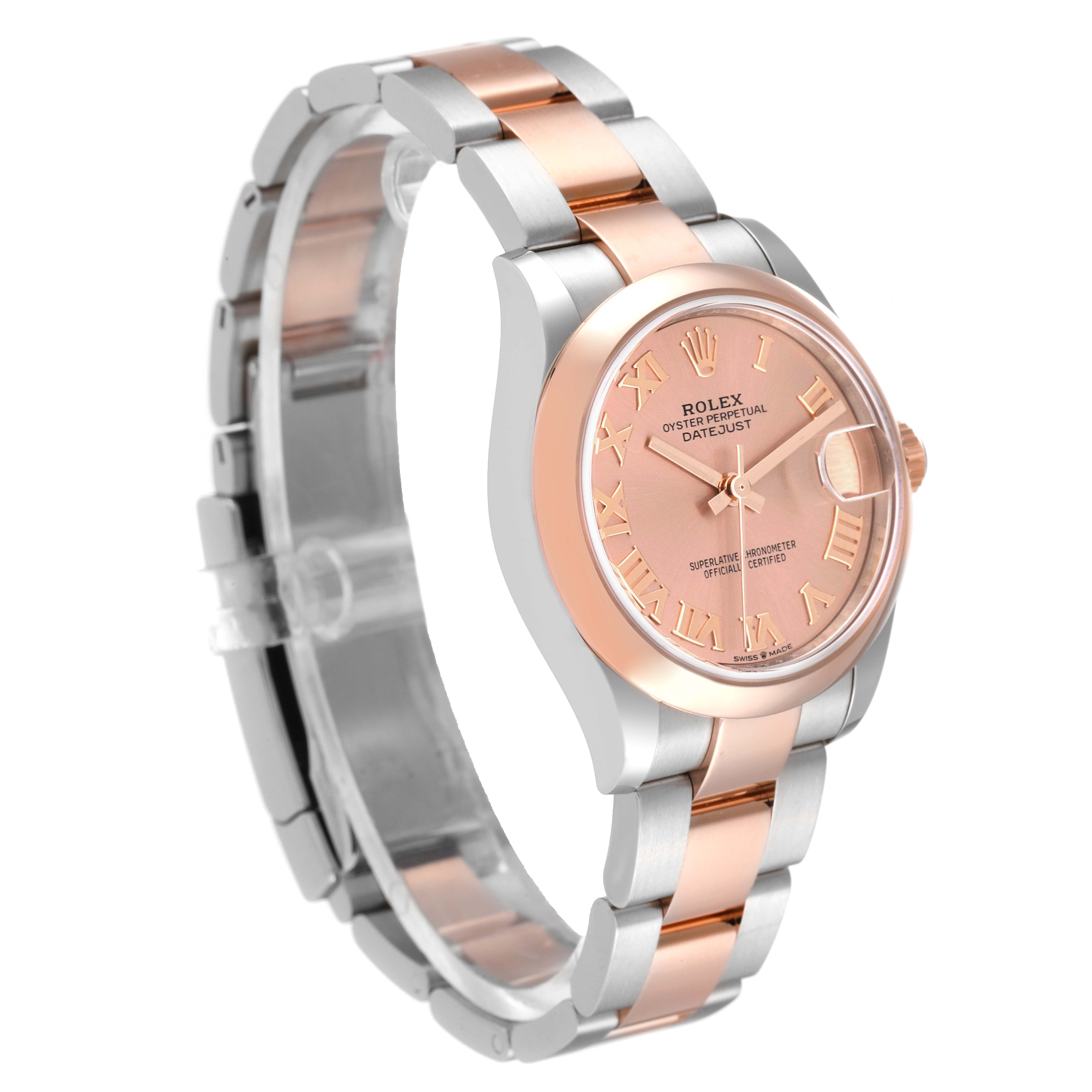 The image shows a side view of a Rolex Mid-Size 278241 Women's Steel and Gold (two tone) Pink Dial 278241 Women's Steel and Gold (two tone) Pink Dial Datejust with a rose gold and silver bracelet, featuring its face and clasp.