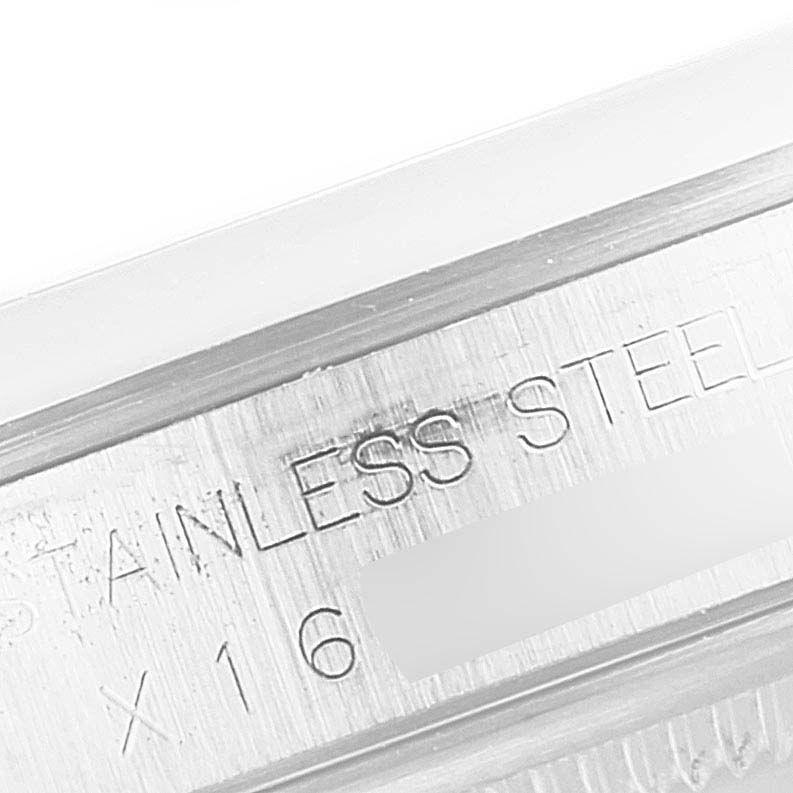 The image shows a close-up of the stainless steel engraving on a Rolex Datejust 16200 Men's Stainless Steel Silver Dial 16200 Men's Stainless Steel Silver Dial watch, including part of its model or serial number.