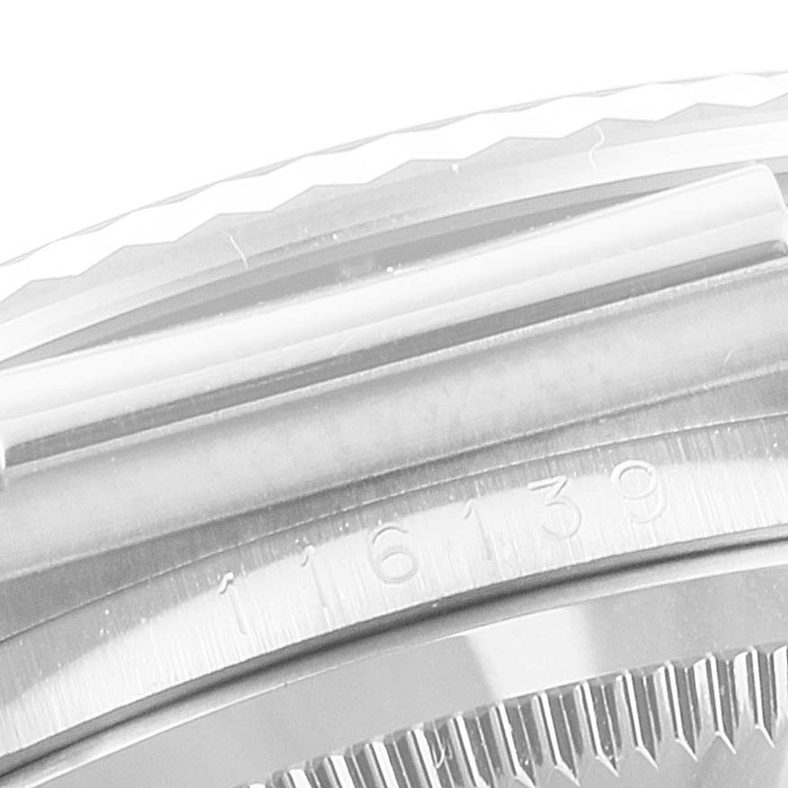 The image shows a close-up of the bezel and part of the case with serial numbers of a Rolex Datejust 116139 Men
s White Gold Silver Dial 116139 Men
s White Gold Silver Dial watch.