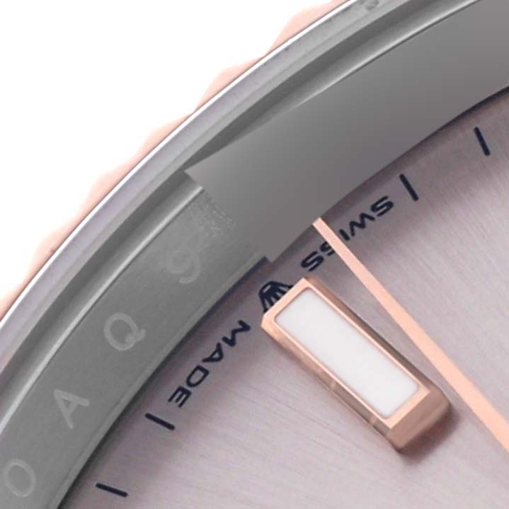The image shows a close-up of the Rolex Datejust 41 126331 Men's Steel and Gold (two tone) Pink Dial 126331 Men's Steel and Gold (two tone) Pink Dial, highlighting the bezel, dial, and index marker.