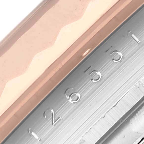 The image shows a close-up of the bezel and part of the dial with numbers on the Rolex Datejust 41 126331 Men's Steel and Gold (two tone) Pink Dial 126331 Men's Steel and Gold (two tone) Pink Dial.