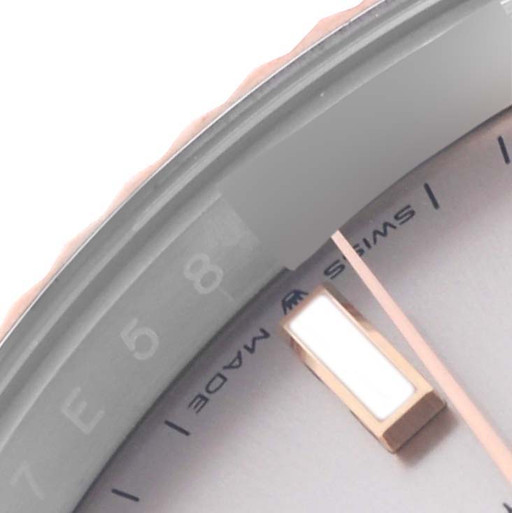 The image shows a close-up of the Rolex Datejust 41 126331 Men's Steel and Gold (two tone) Pink Dial 126331 Men's Steel and Gold (two tone) Pink Dial's dial and part of the hour markers.