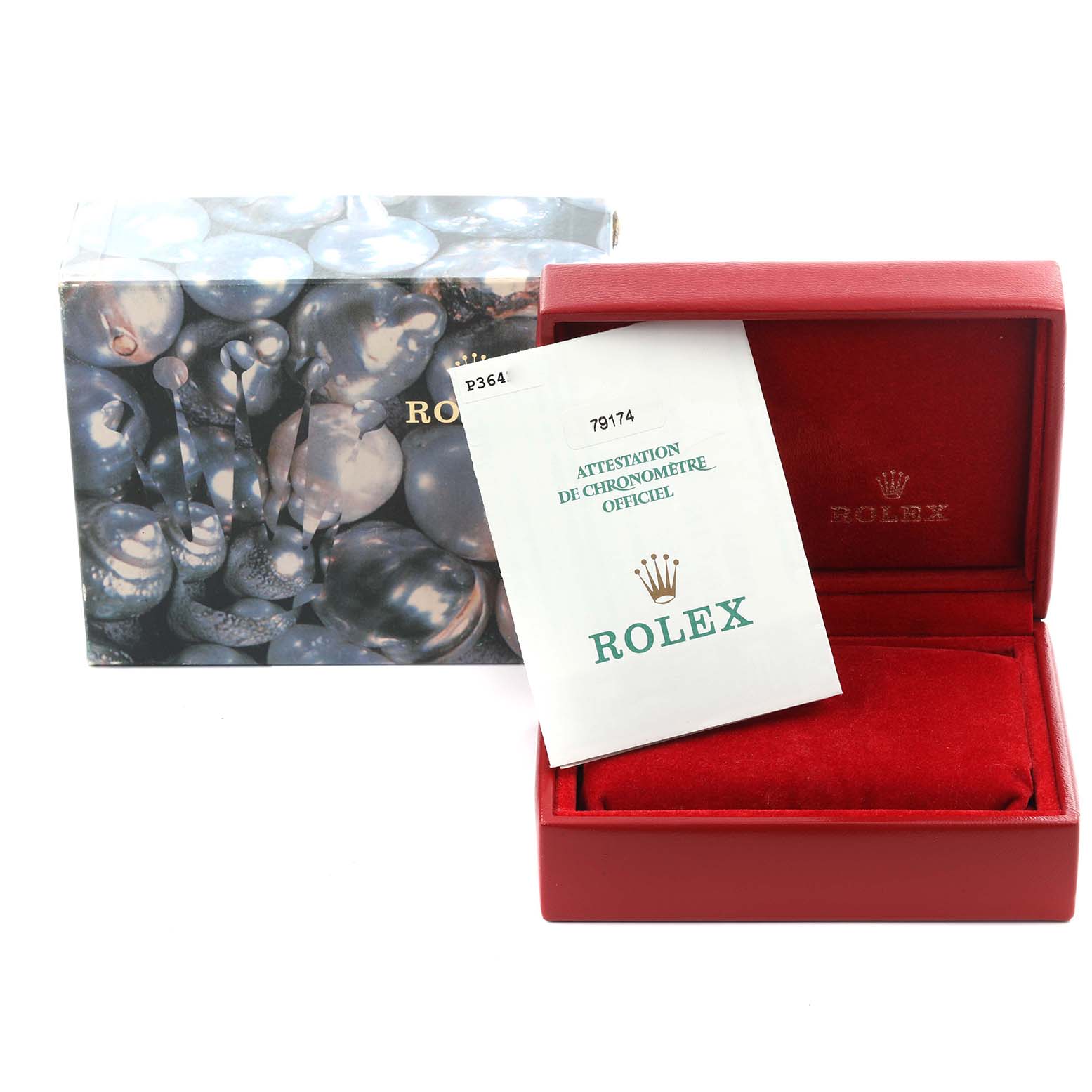 The image shows a Rolex Datejust 79174 Women
s Stainless Steel Black Dial 79174 Women
s Stainless Steel Black Dial watch box, a certificate, and an outer box from a front angle.