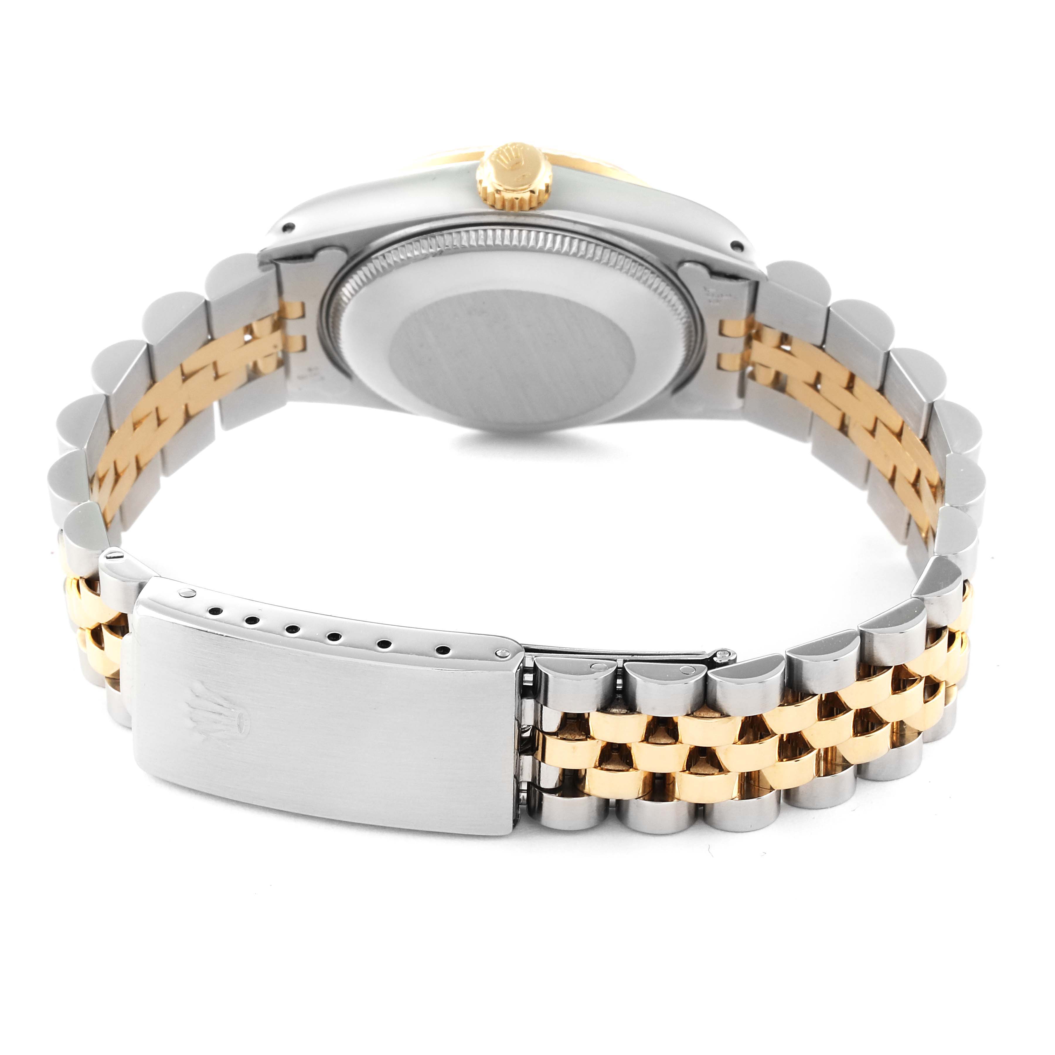 This image shows the back case and Jubilee bracelet of a mid-size Rolex watch, viewed from the rear angle.