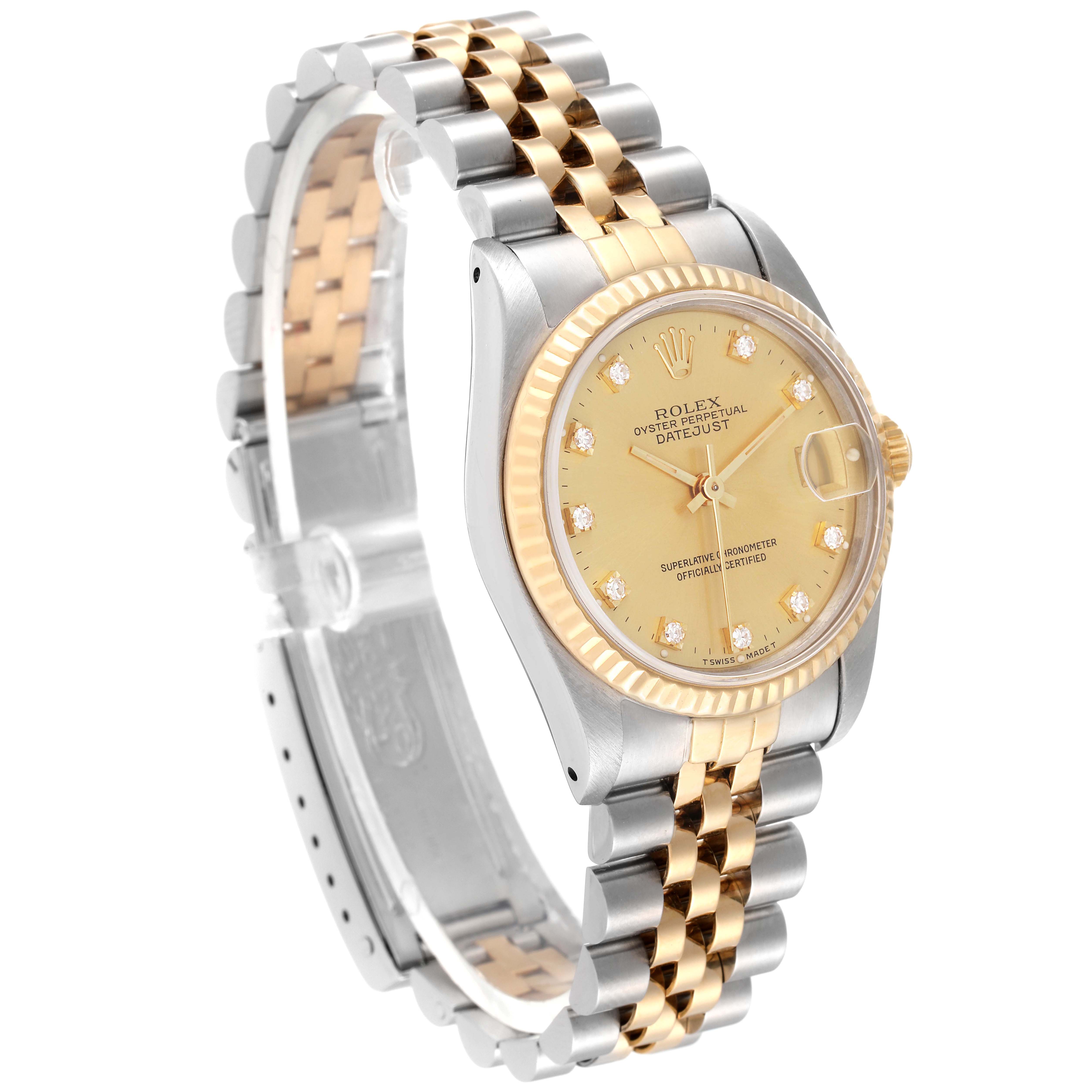 This image shows a Rolex Mid-Size 68273 Women
s Steel and Gold (two tone) Champagne Dial 68273 Women
s Steel and Gold (two tone) Champagne Dial Datejust watch at an angled view, focusing on the face, bezel, case, and bracelet.