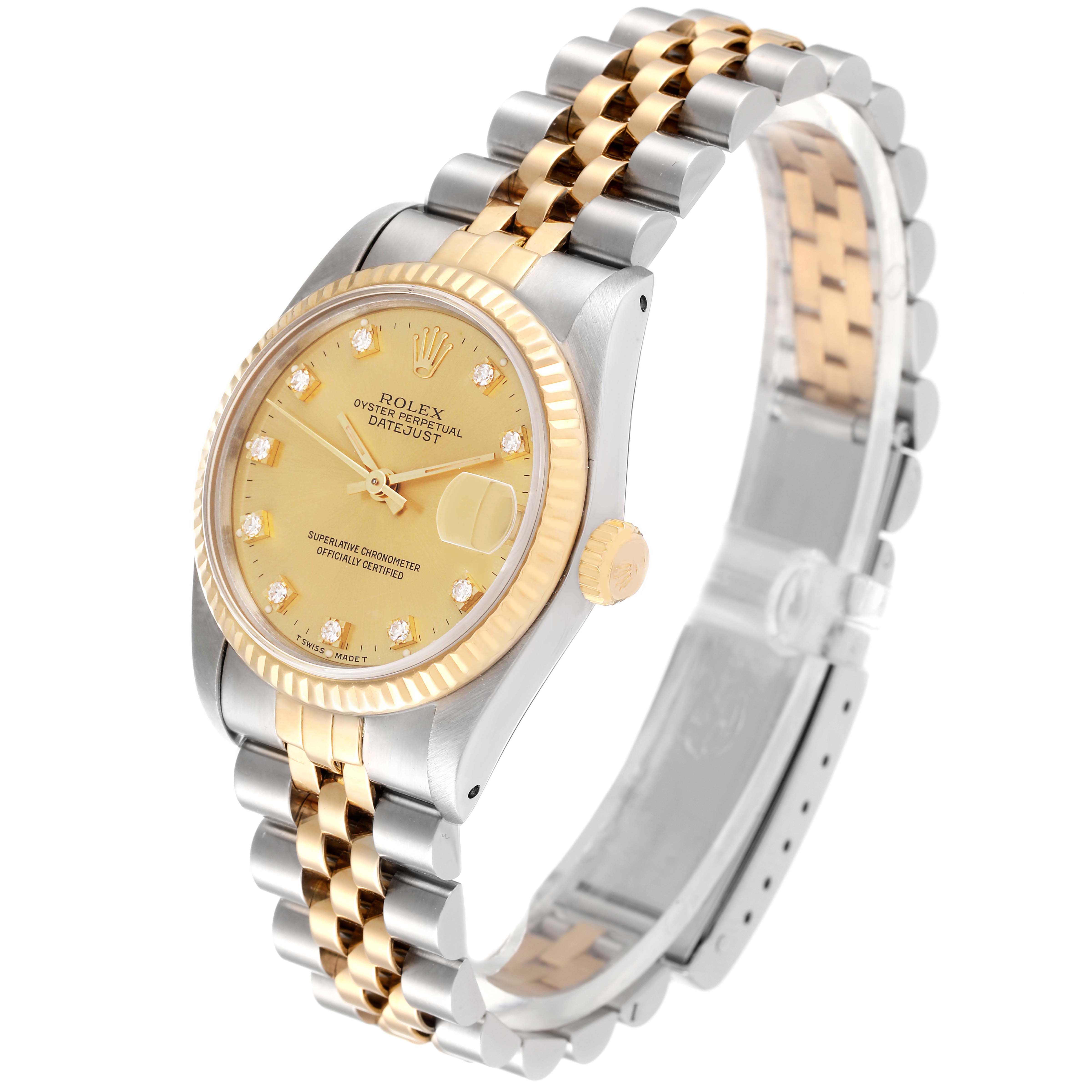 The Mid-Size Rolex watch is shown at an angle displaying the dial, bezel, crown, and two-tone bracelet.