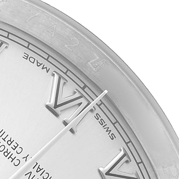 The image shows a close-up of the dial, hands, and partial bezel of the Rolex Datejust 116200 Men's Stainless Steel Silver Dial, focusing on the Roman numeral markers.