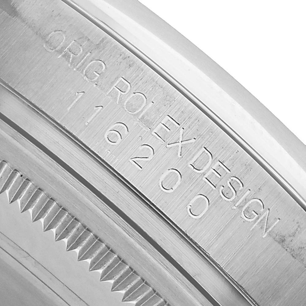 The image shows a close-up of the Rolex Datejust 116200 Men's Stainless Steel Silver Dial model's case side, highlighting the model number engraving.