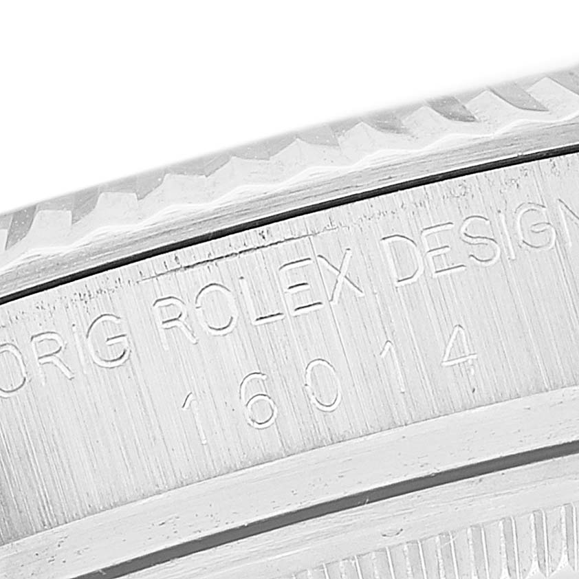 The close-up image of the Rolex Vintage Collection 16014 Men
s Stainless Steel Silver Dial 16014 Men
s Stainless Steel Silver Dial model displays the engravings on its side and part of the bezel.
