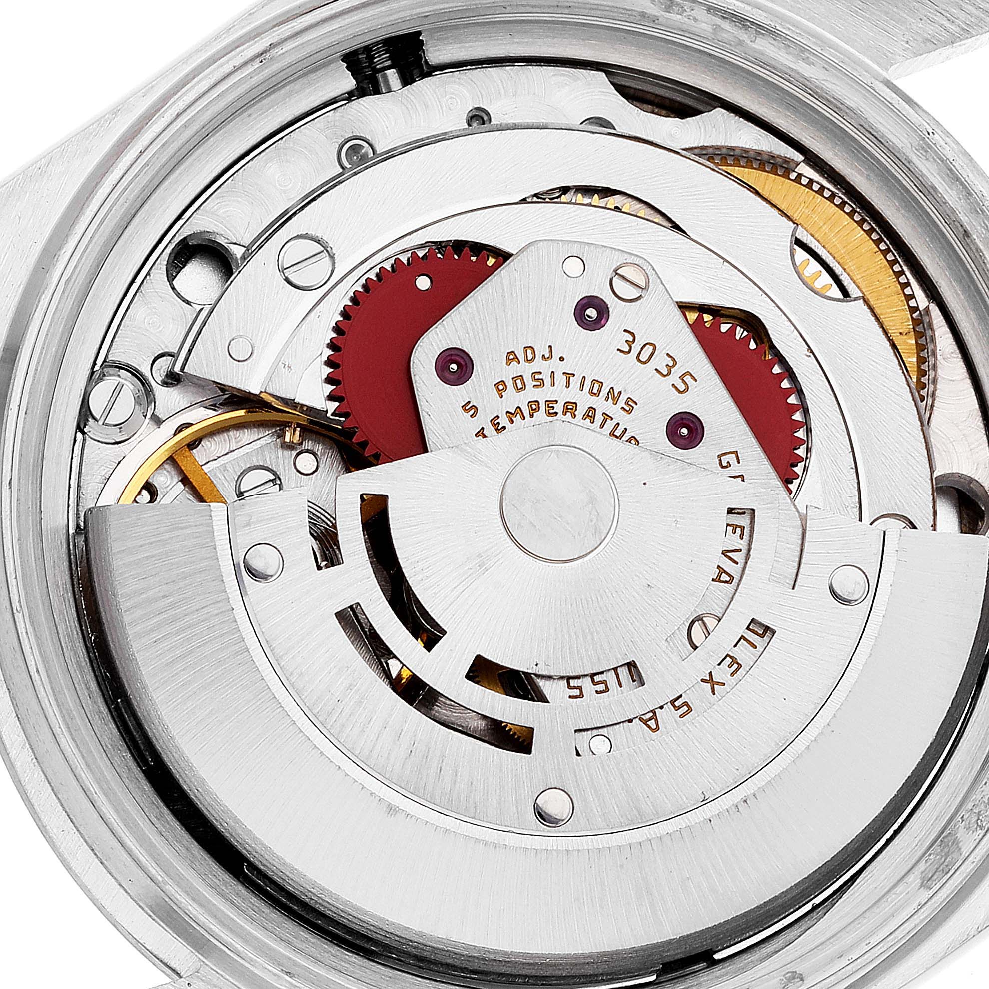 This image shows the intricate internal mechanism of a Rolex Vintage Collection 16014 Men
s Stainless Steel Silver Dial 16014 Men
s Stainless Steel Silver Dial watch, including gears and the rotor.