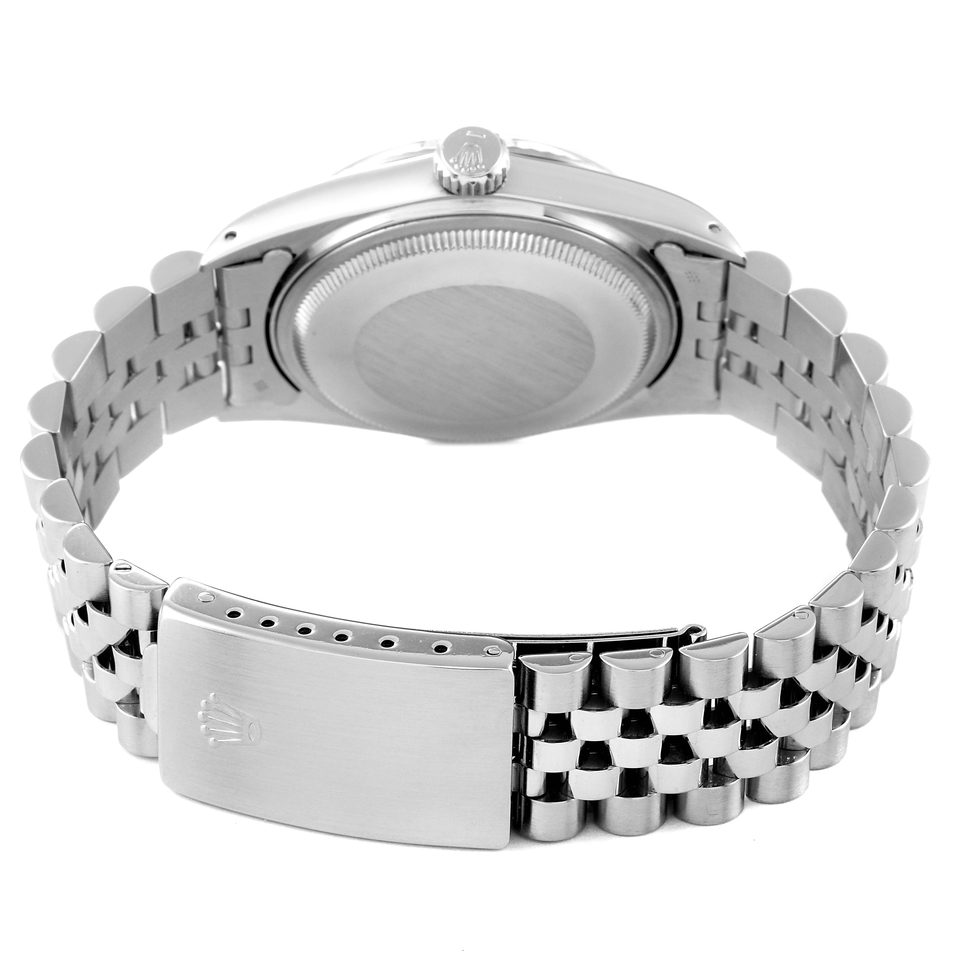 The image shows the back and clasp of the Rolex Vintage Collection 16014 Men
s Stainless Steel Silver Dial 16014 Men
s Stainless Steel Silver Dial watch, with a focus on the case back and stainless steel bracelet.