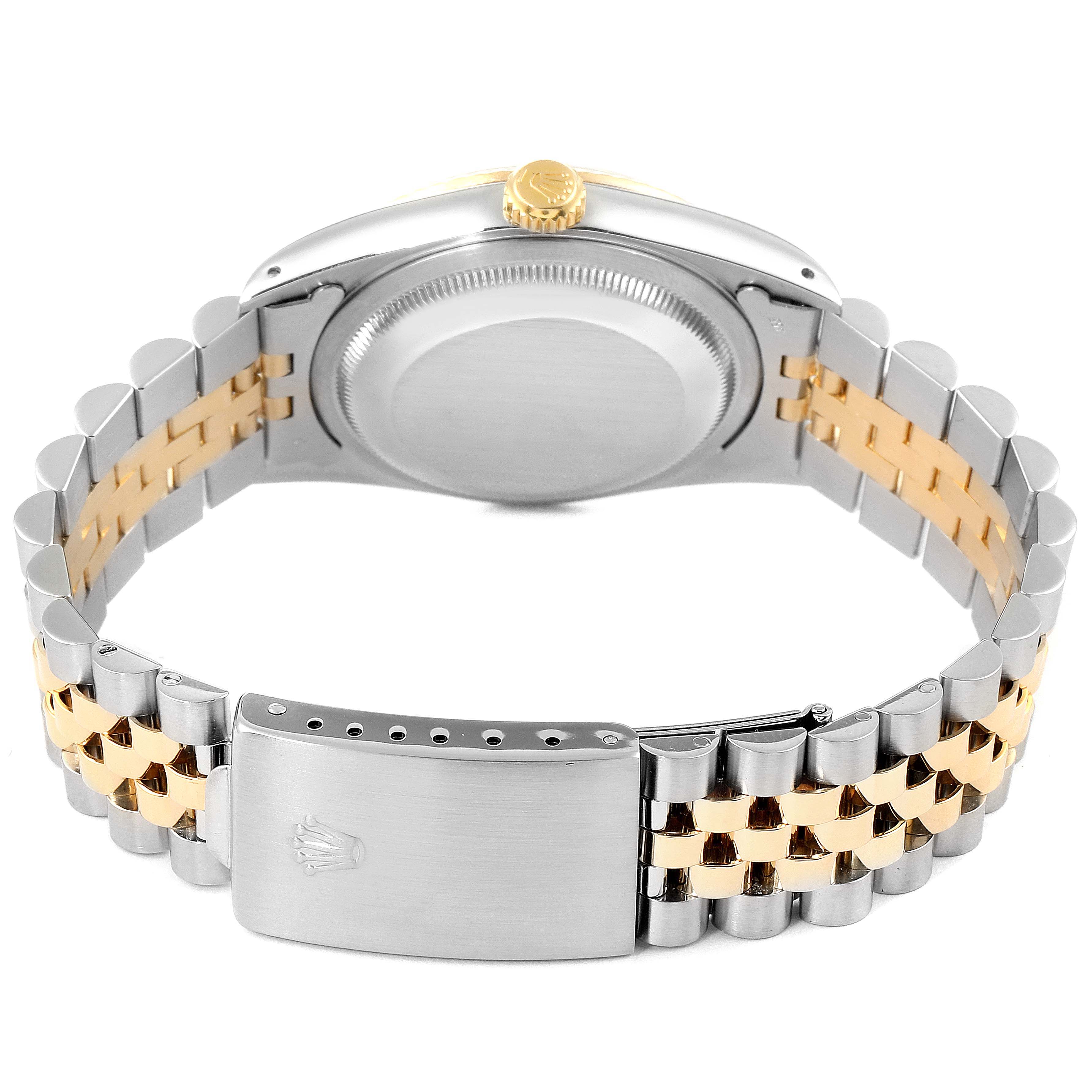 The image shows the back and side view of a Rolex Datejust 16233 Men's Steel and Gold (two tone) Champagne Dial 16233 Men's Steel and Gold (two tone) Champagne Dial watch, highlighting its two-tone bracelet and clasp.