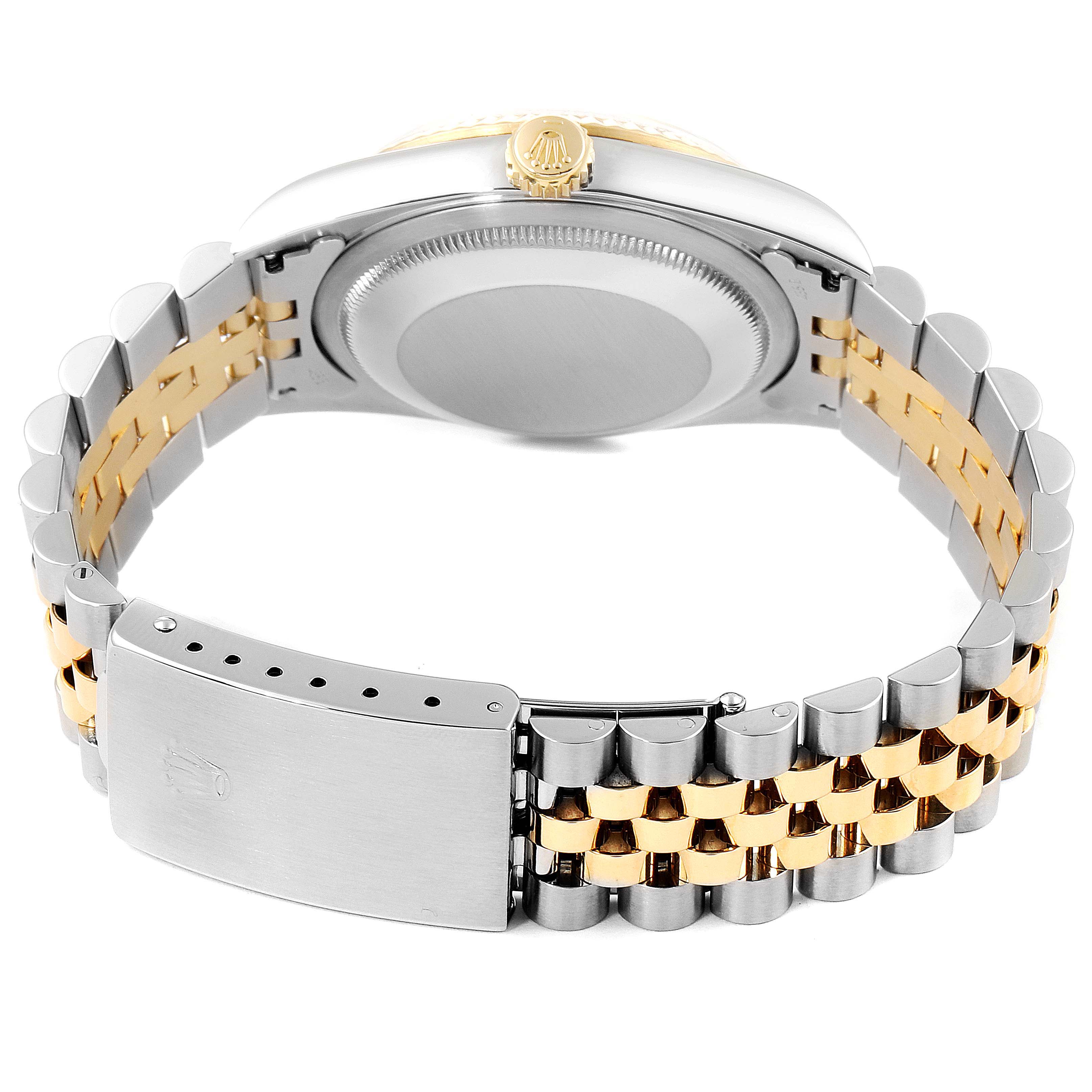 This image shows the backside of a Rolex Datejust 16233 Men's Steel and Gold (two tone) Champagne Dial 16233 Men's Steel and Gold (two tone) Champagne Dial watch, highlighting the case back and two-tone bracelet with the clasp.