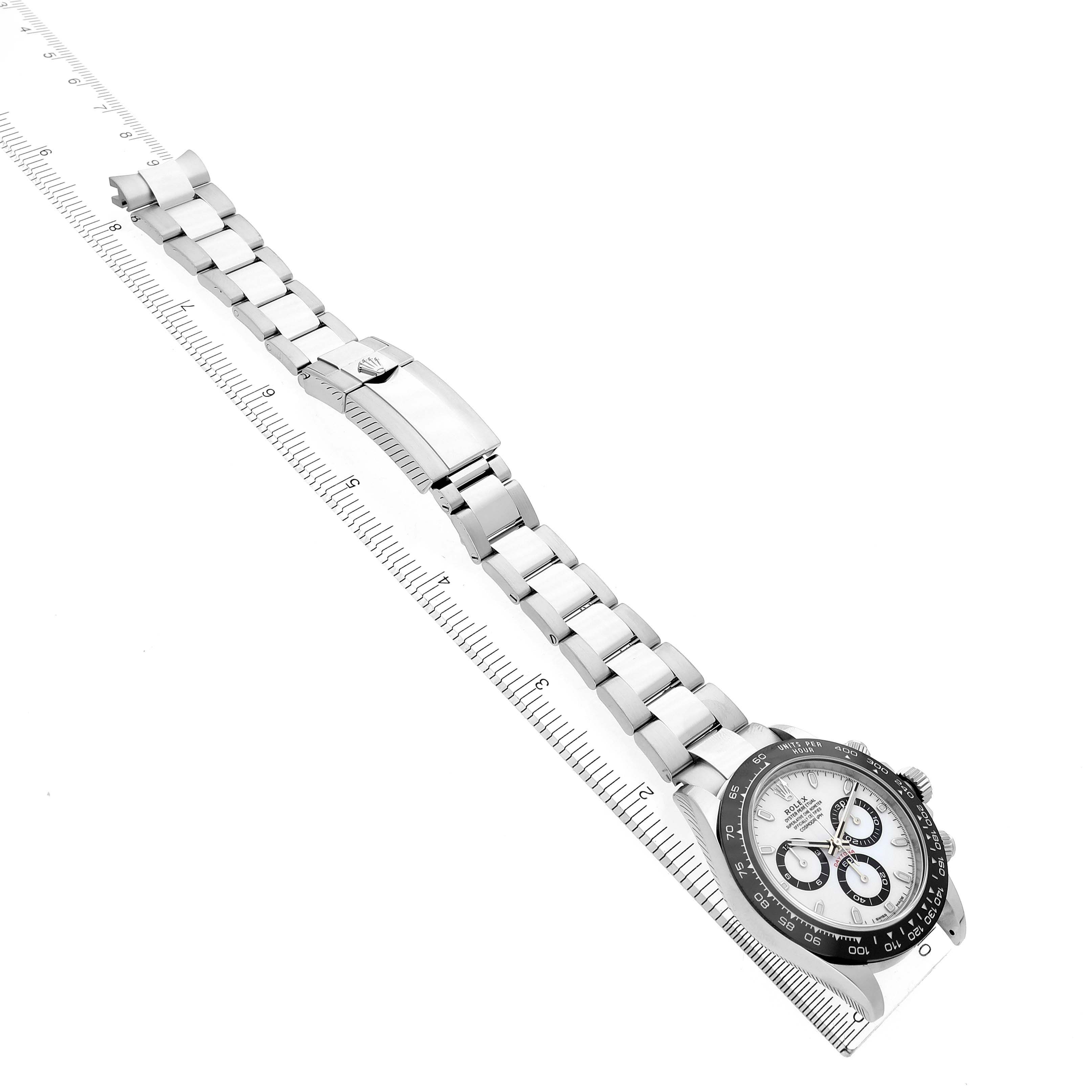 The Rolex Daytona 116500LN Men's Stainless Steel White Dial 116500LN Men's Stainless Steel White Dial watch is shown from a diagonal top-down angle, displaying the face and full bracelet length with its clasp extended.