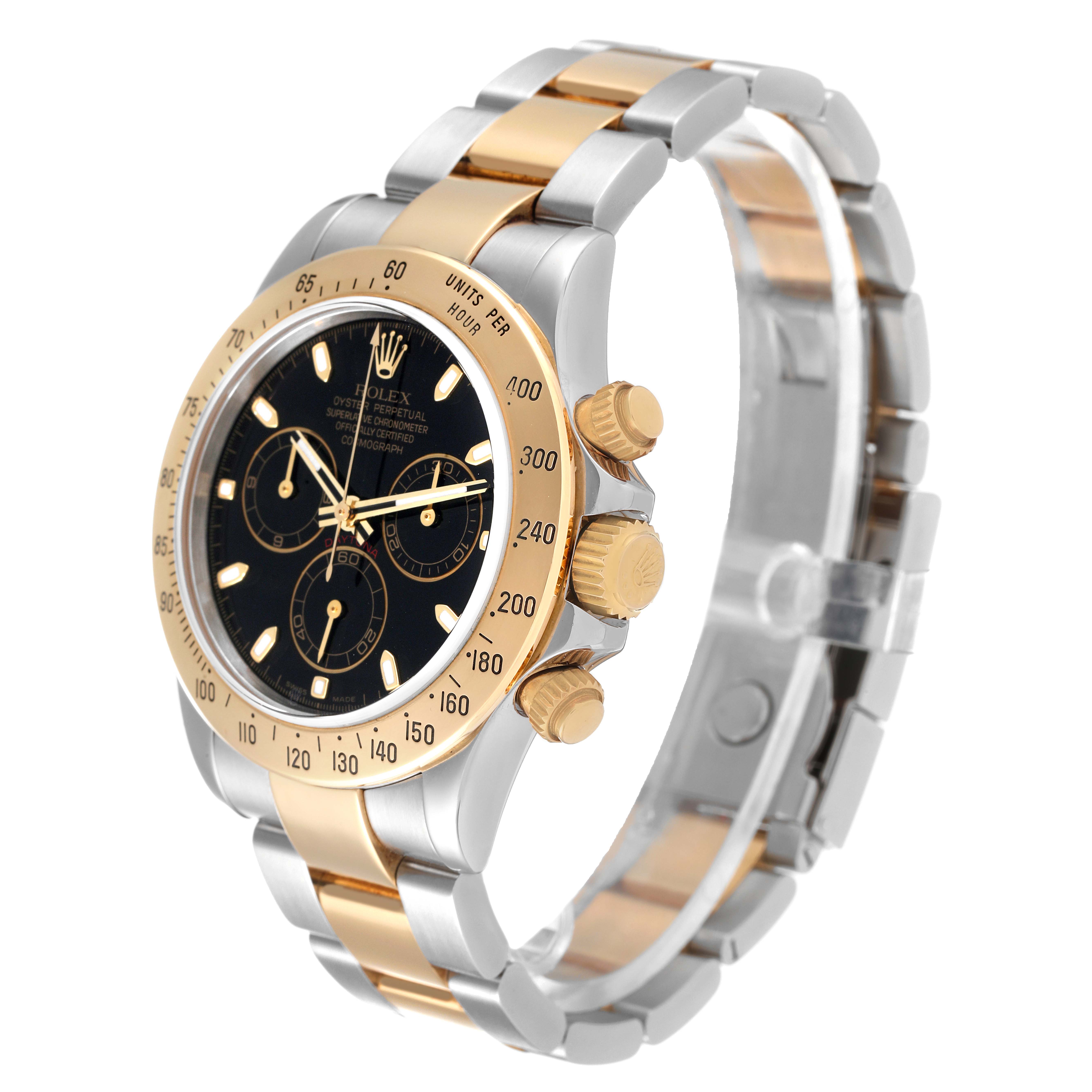 The image shows a side-angle view of the Rolex Daytona 116523 Men's Steel and Gold (two tone) Black Dial 116523 Men's Steel and Gold (two tone) Black Dial watch, highlighting its black dial, gold bezel, and two-tone bracelet.