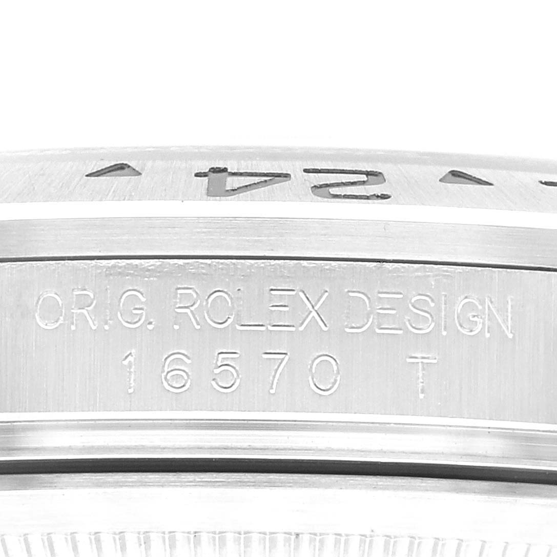 The image shows a close-up of the bezel and case side of a Rolex Explorer 16570 Men
s Stainless Steel Black Dial 16570 Men
s Stainless Steel Black Dial model, displaying the model number 16570.