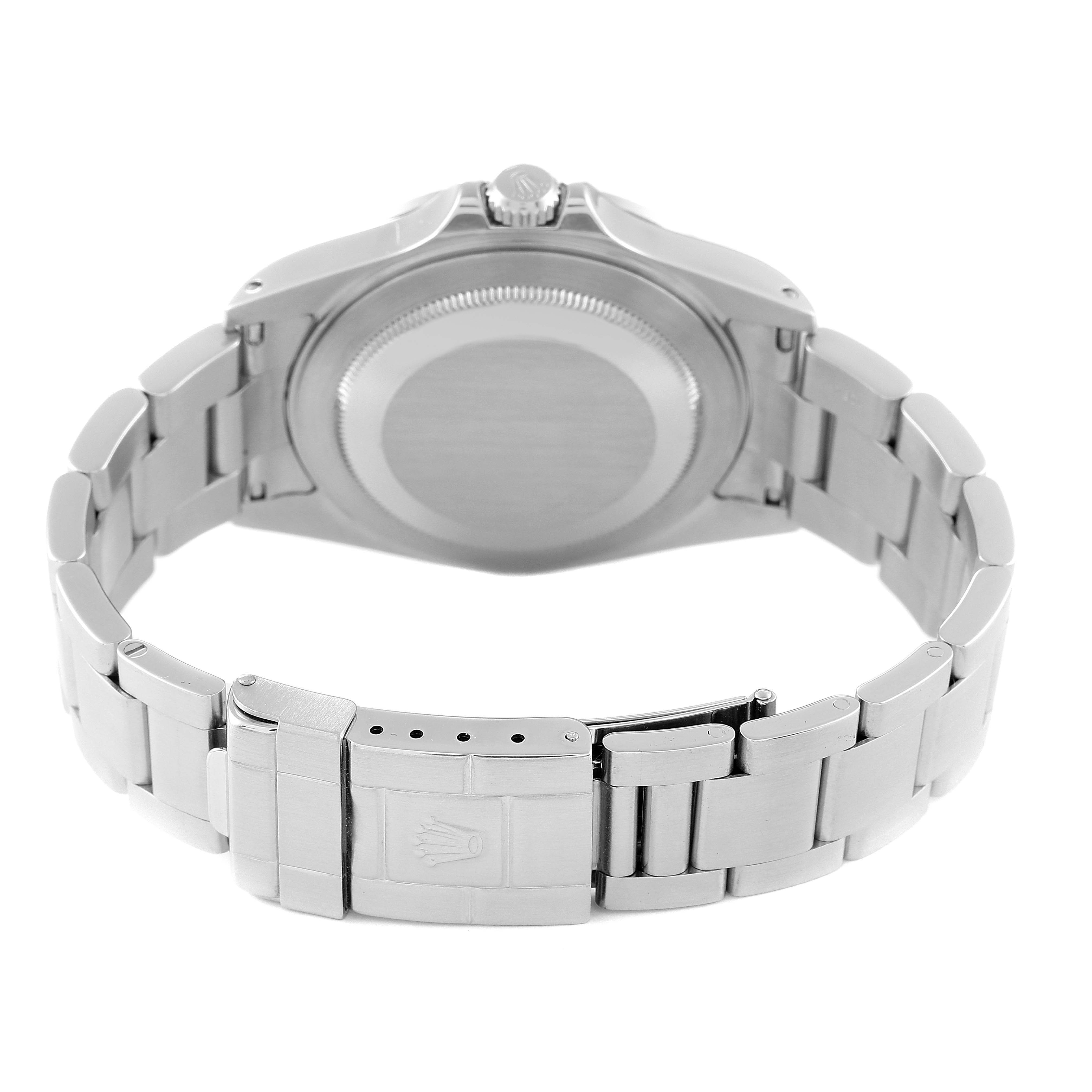 The image shows a Rolex Explorer 16570 Men
s Stainless Steel Black Dial 16570 Men
s Stainless Steel Black Dial watch from the back, highlighting the case back, the bracelet, and the clasp.