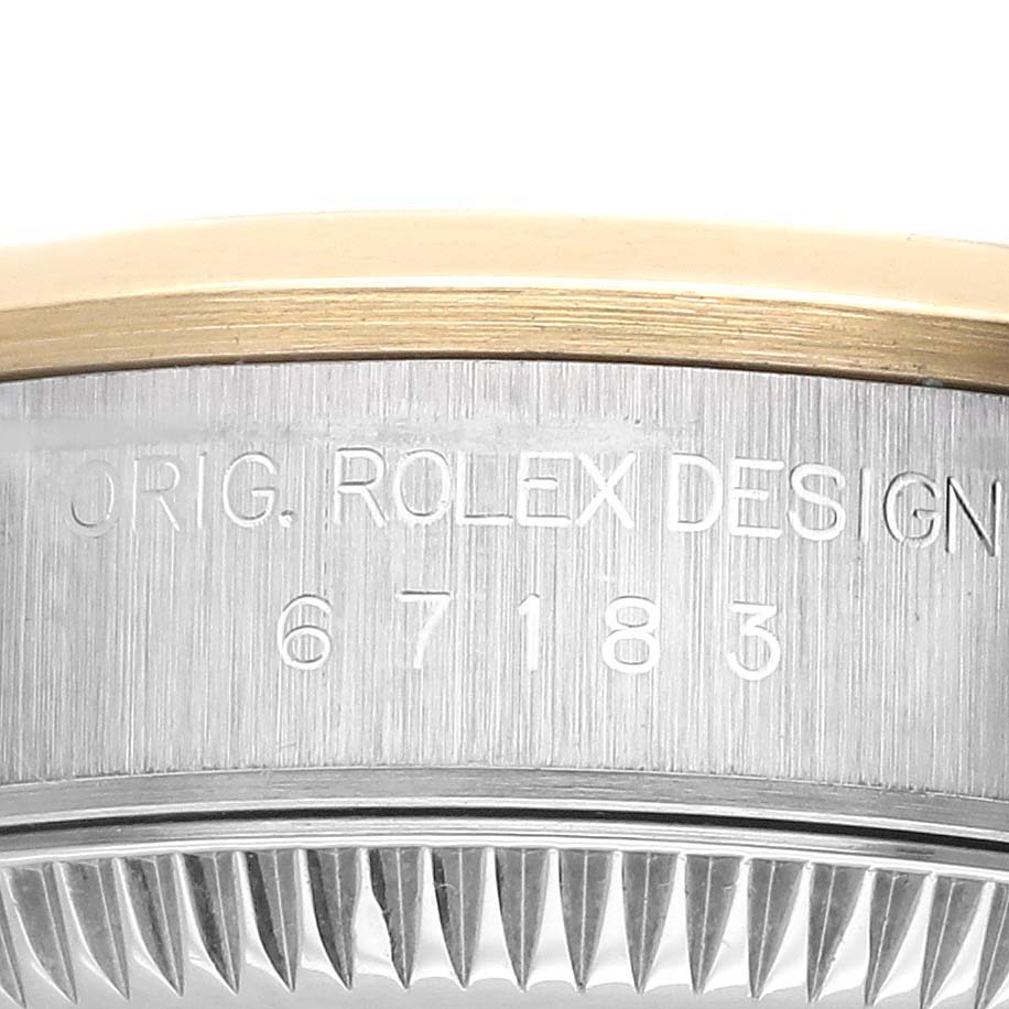 The image shows the side engraving on the bezel and case of a Rolex Oyster Perpetual 67183 Women's Steel and Gold (two tone) Grey Dial 67183 Women's Steel and Gold (two tone) Grey Dial, highlighting "Orig. Rolex Design."